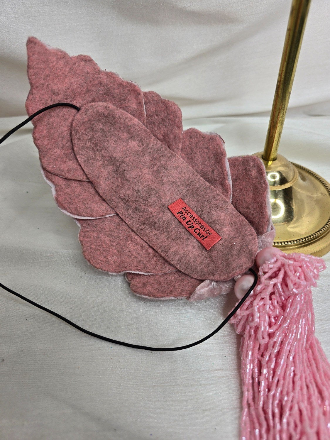 Pale pink velvet petal half hat fascinator with beaded tassels
