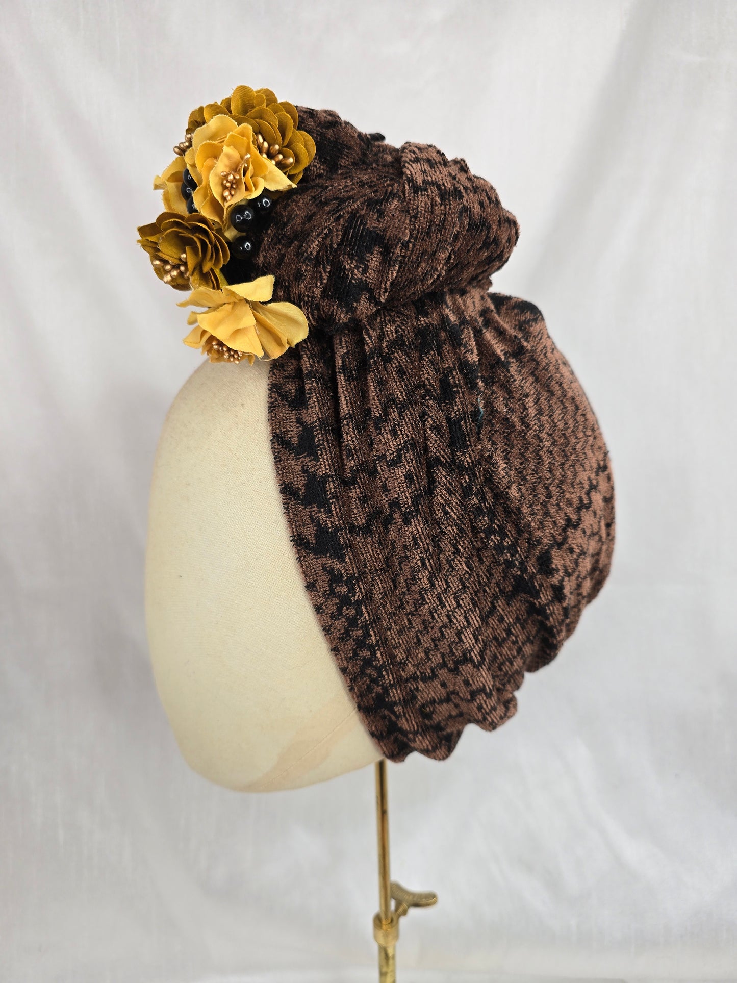 Brown houndstooth stretch velvet turban with mustard flowers