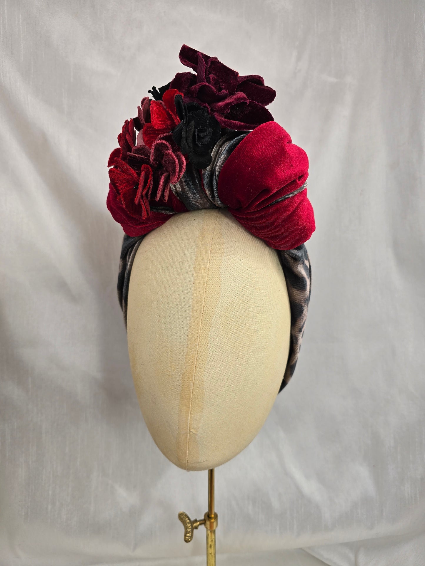 Red and leopard stretch velvet turban with corsage