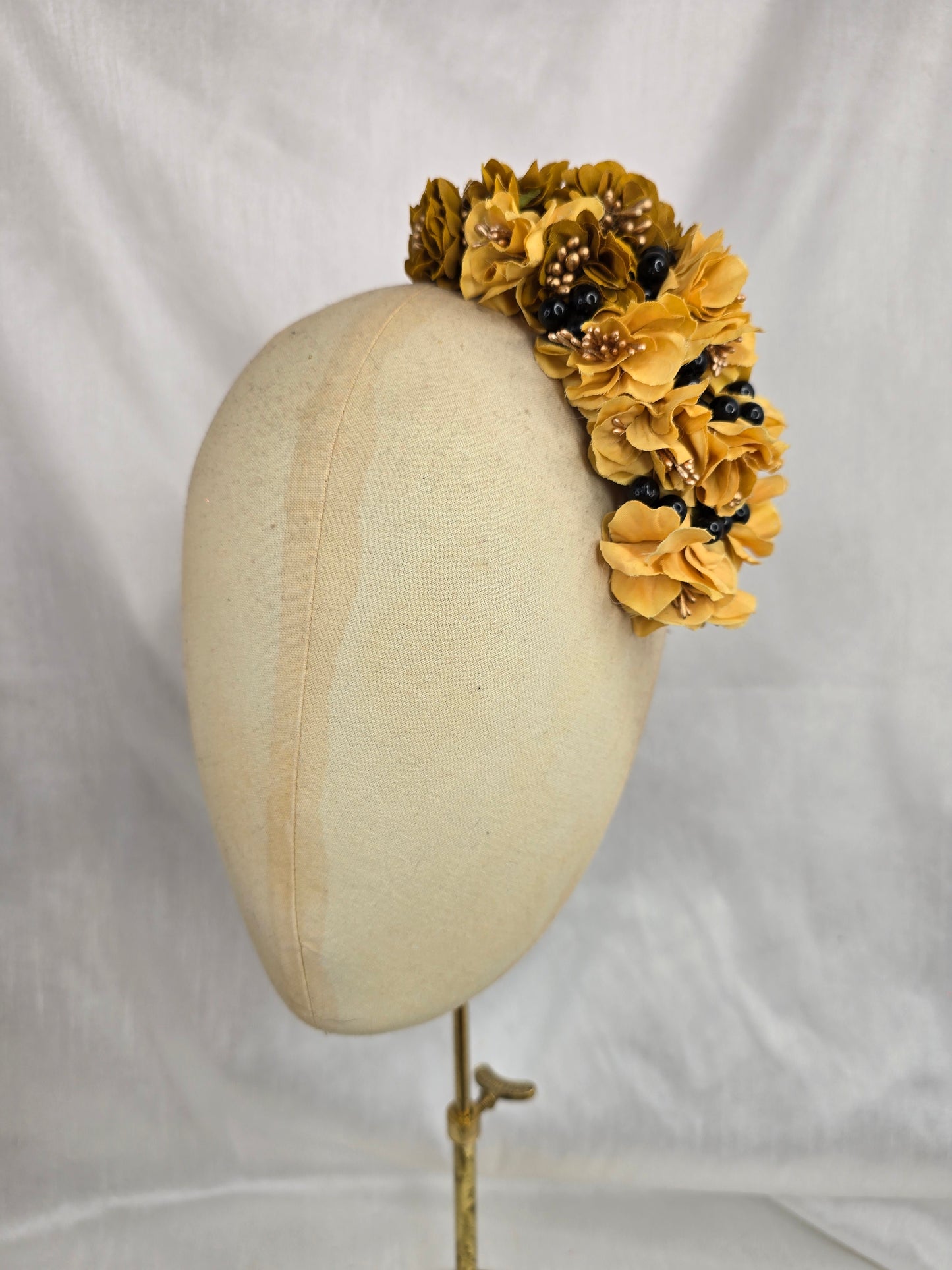 Brown houndstooth stretch velvet turban with mustard flowers