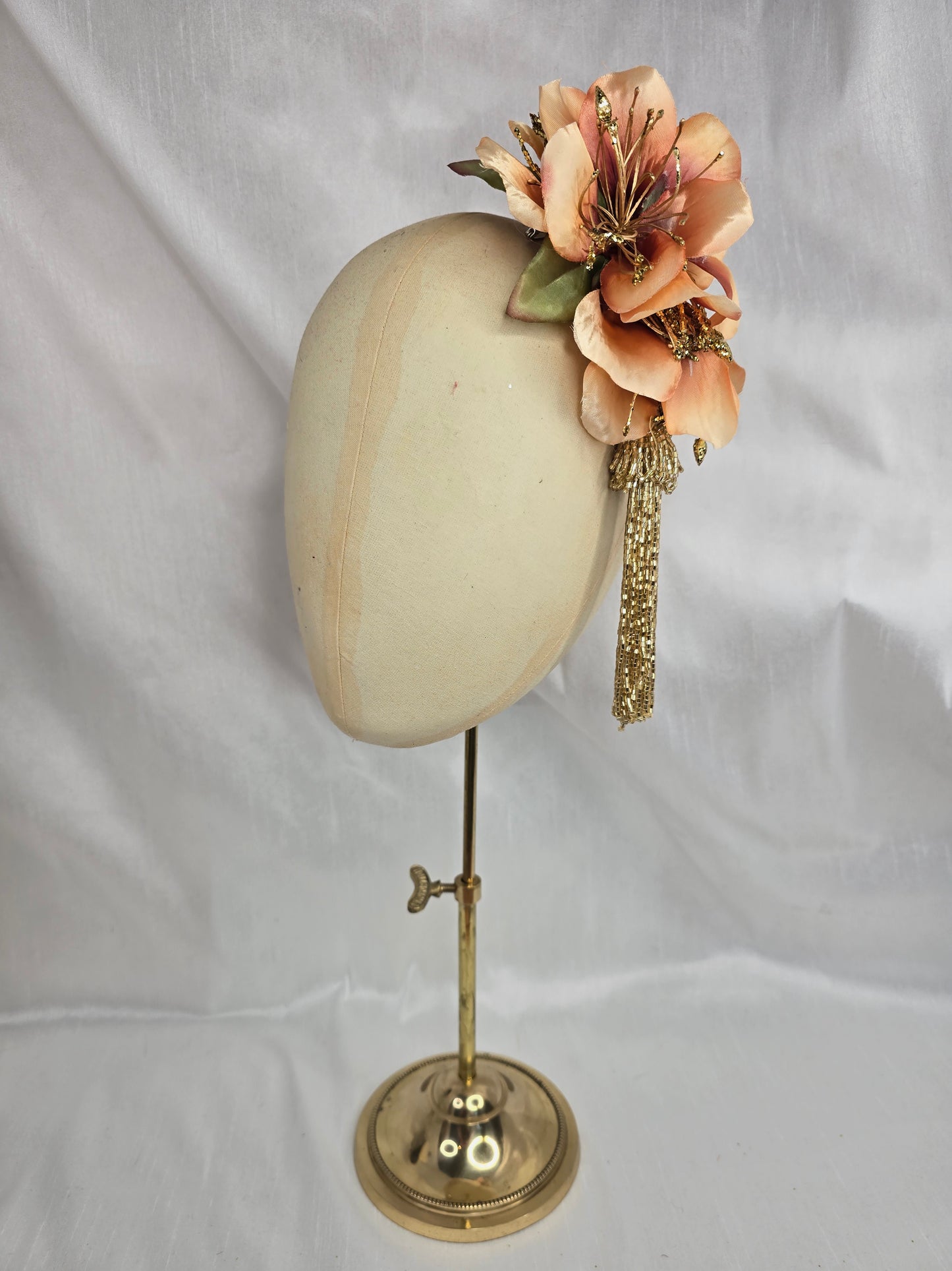 Medium pale orange and gold hair flower/corsage with beaded tassel