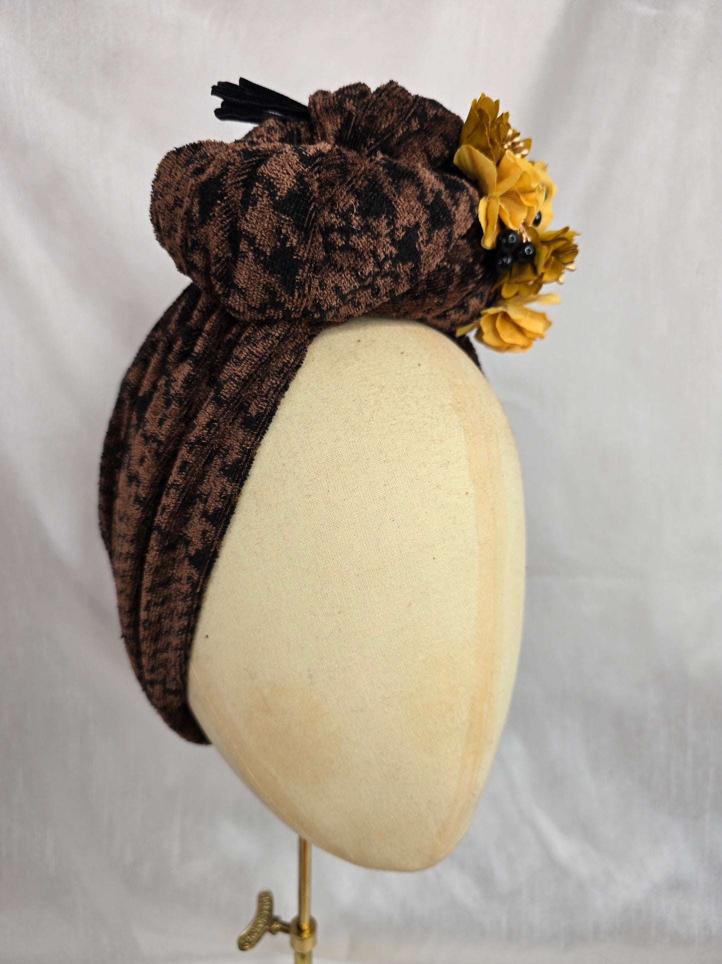 Brown houndstooth stretch velvet turban with mustard flowers