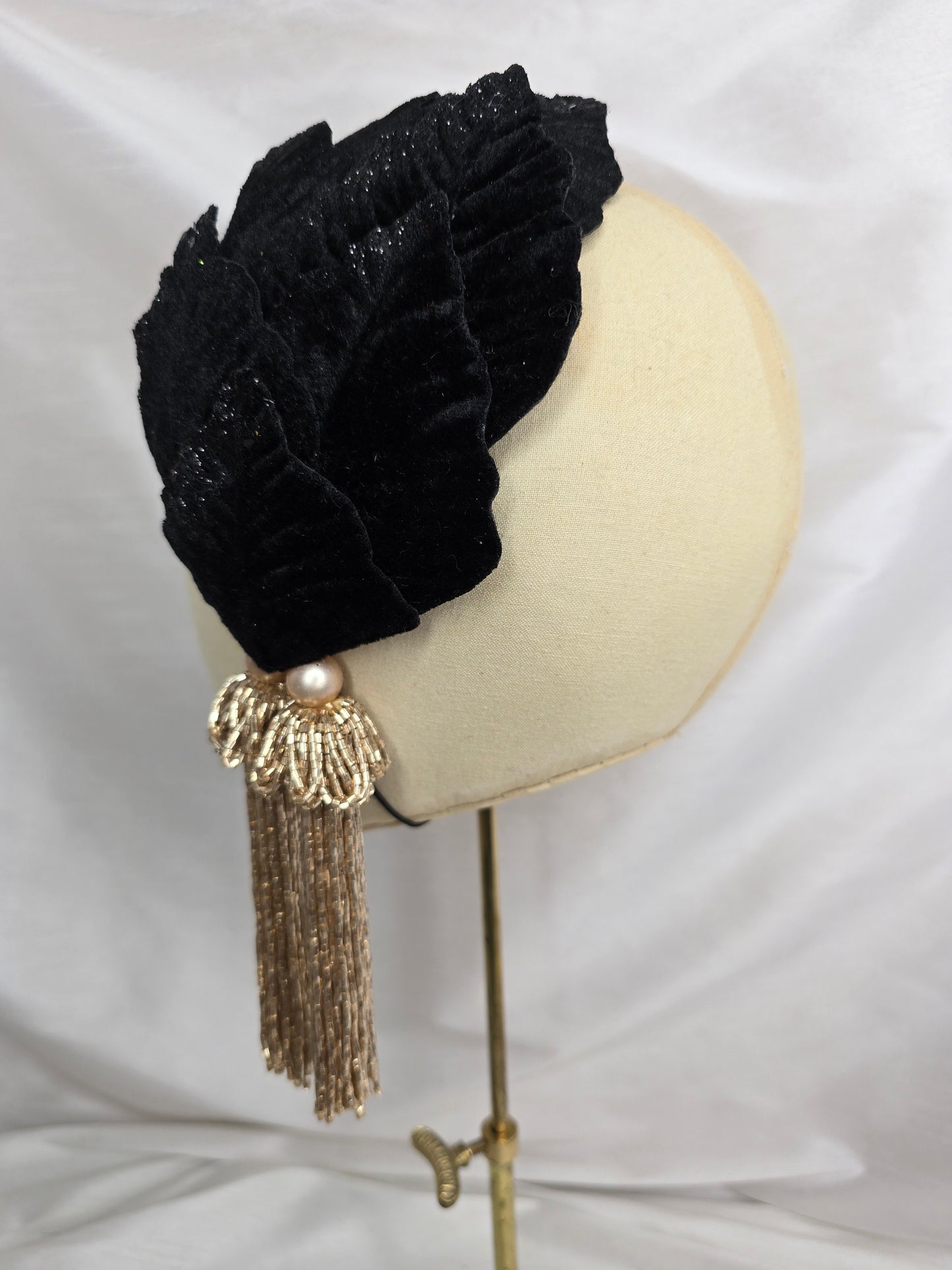 Black velvet glittered half hat/fascinator with gold beaded tassels