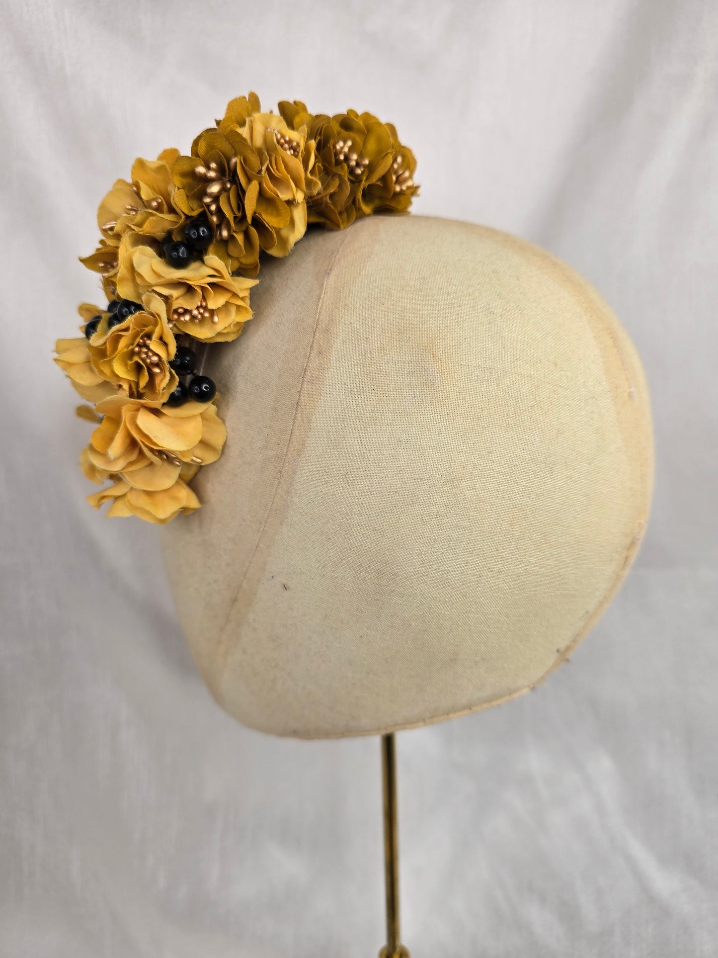 Brown houndstooth stretch velvet turban with mustard flowers