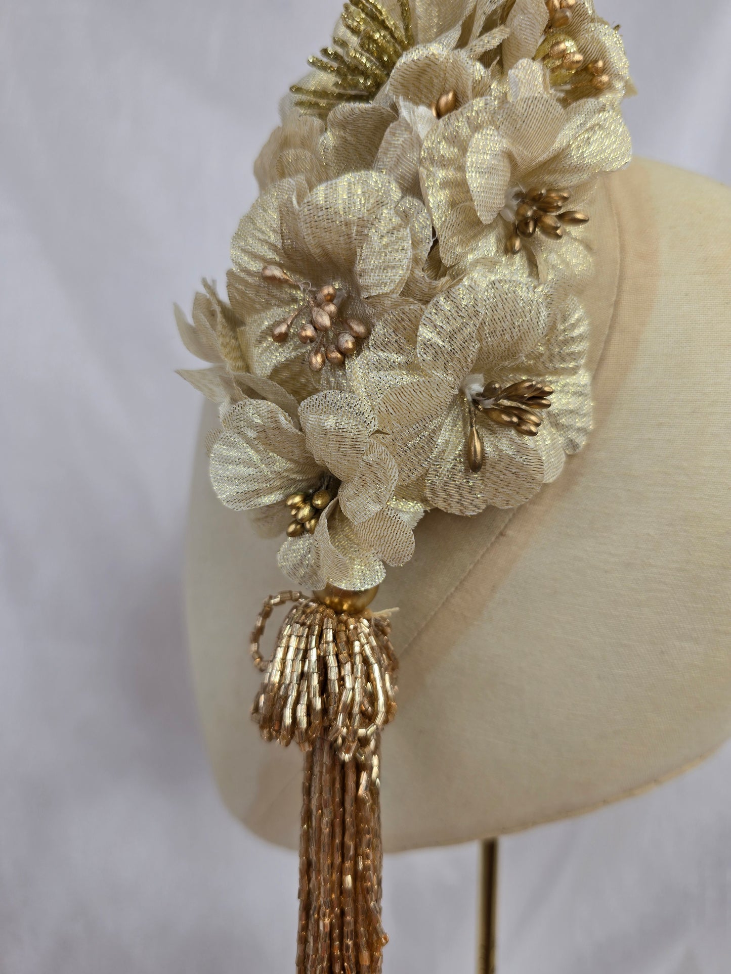 Large gold flower headpiece with beaded tassel