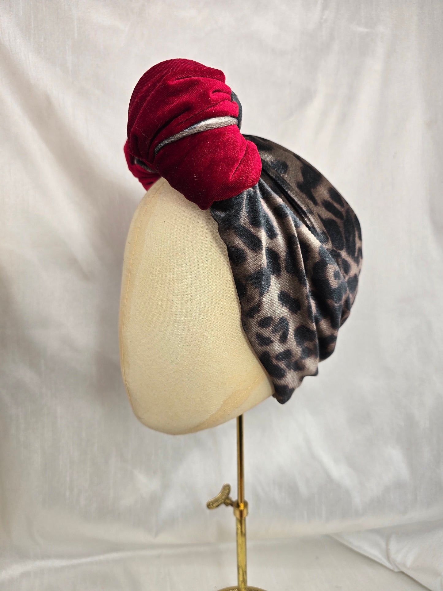 Red and leopard stretch velvet turban with corsage
