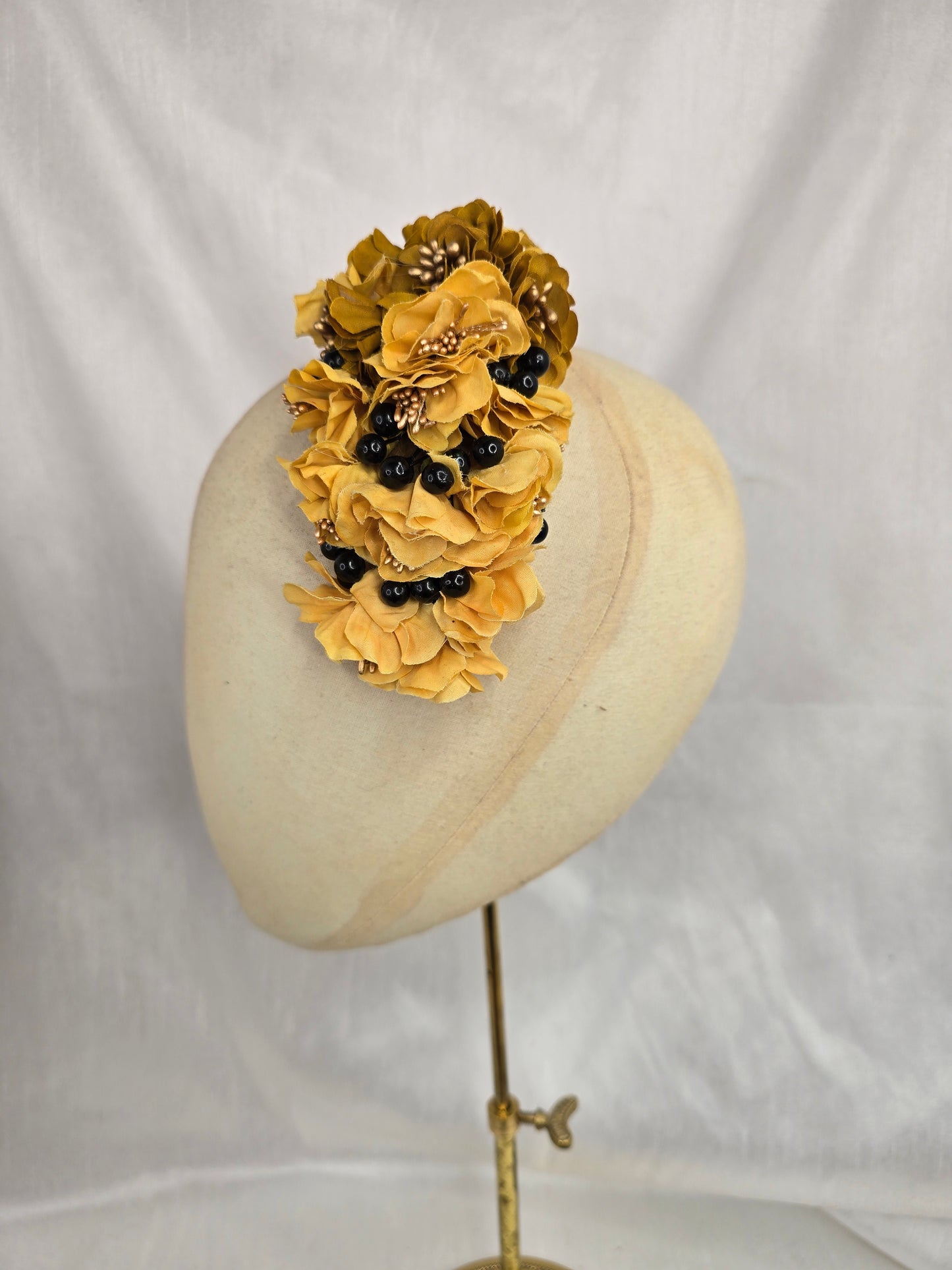 Brown houndstooth stretch velvet turban with mustard flowers