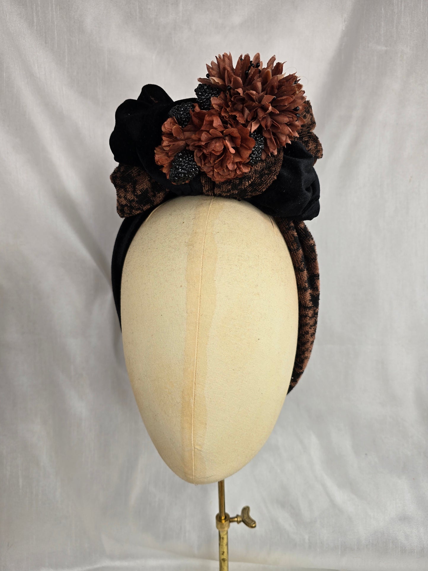 Brown houndstooth and black stretch velvet turban with brown flowers