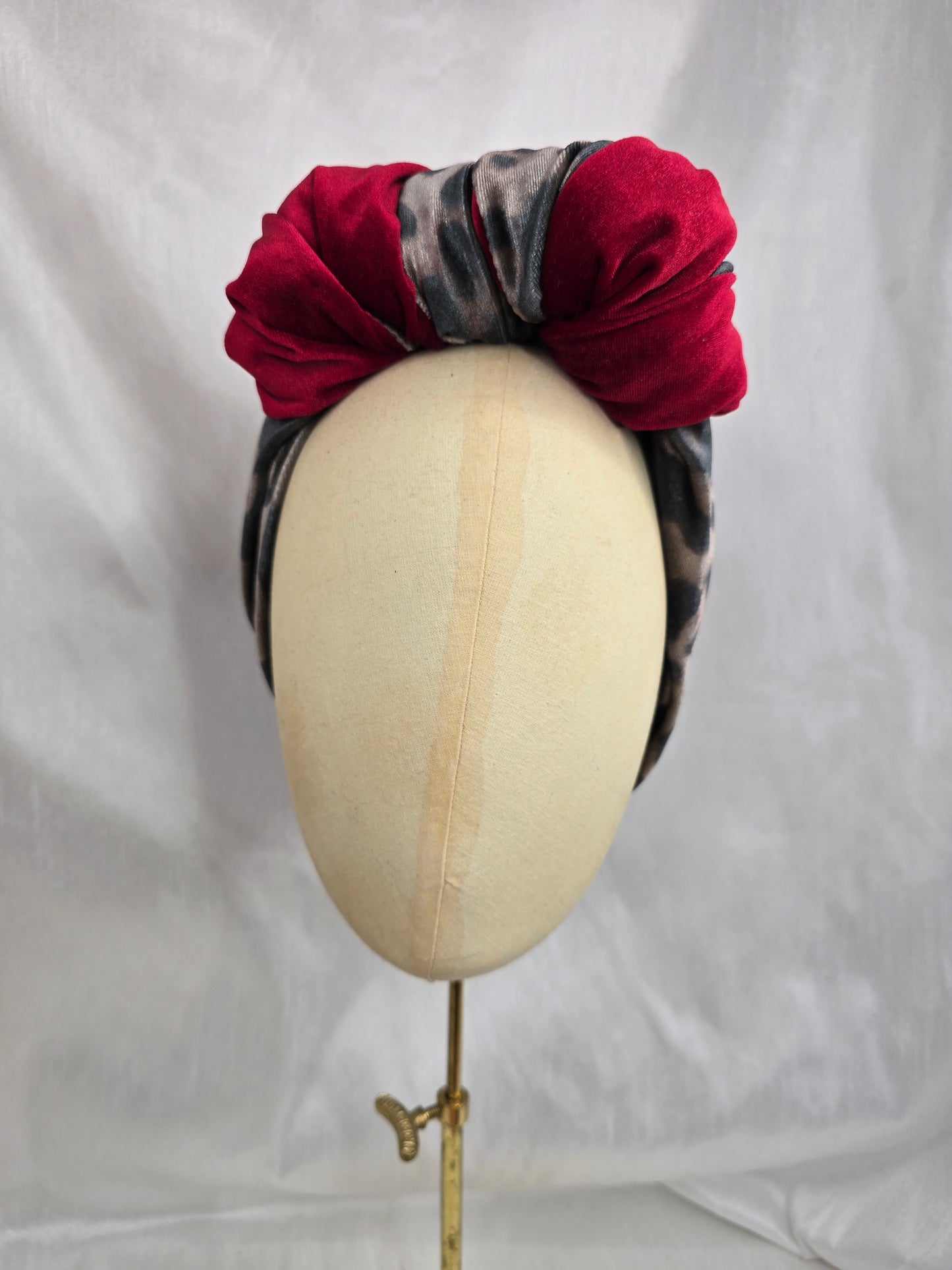 Red and leopard stretch velvet turban with corsage