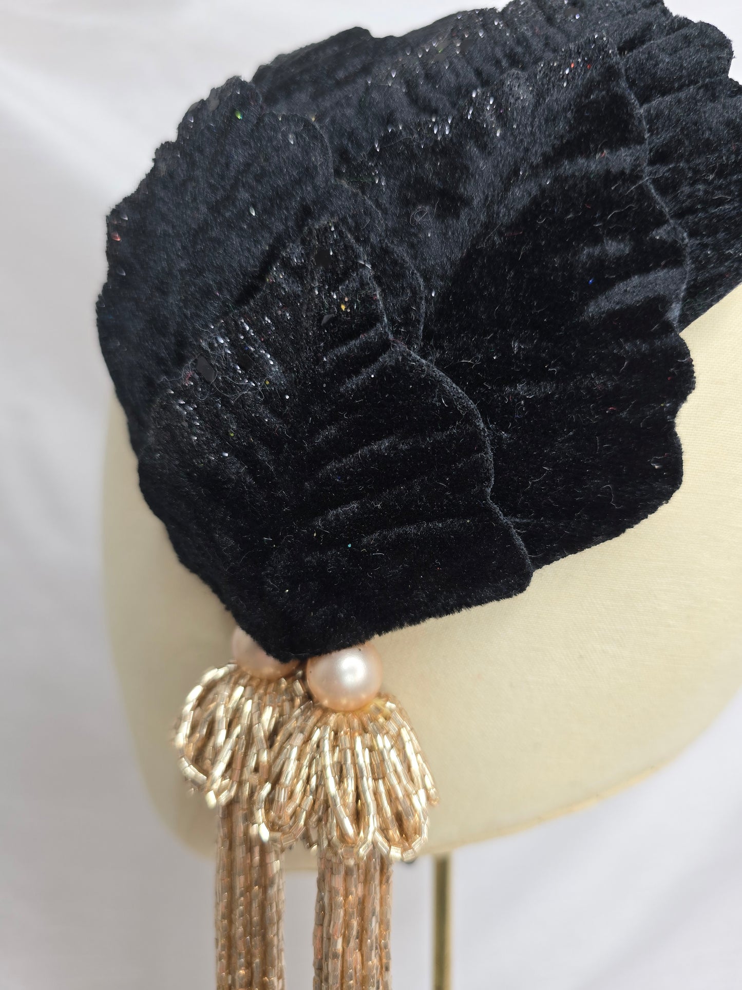 Black velvet glittered half hat/fascinator with gold beaded tassels
