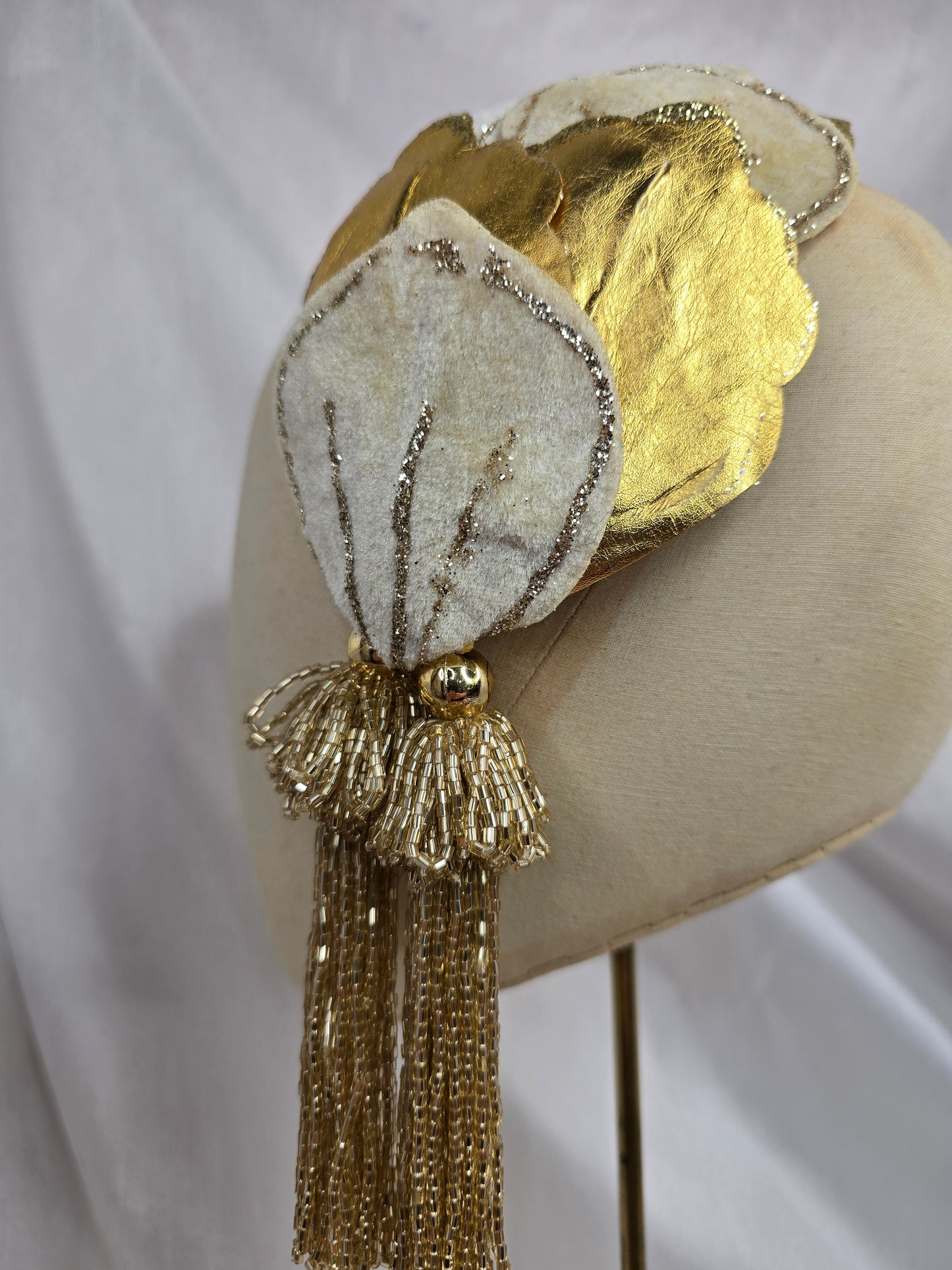 Ivory and gold half hat/fascinator with beaded tassels
