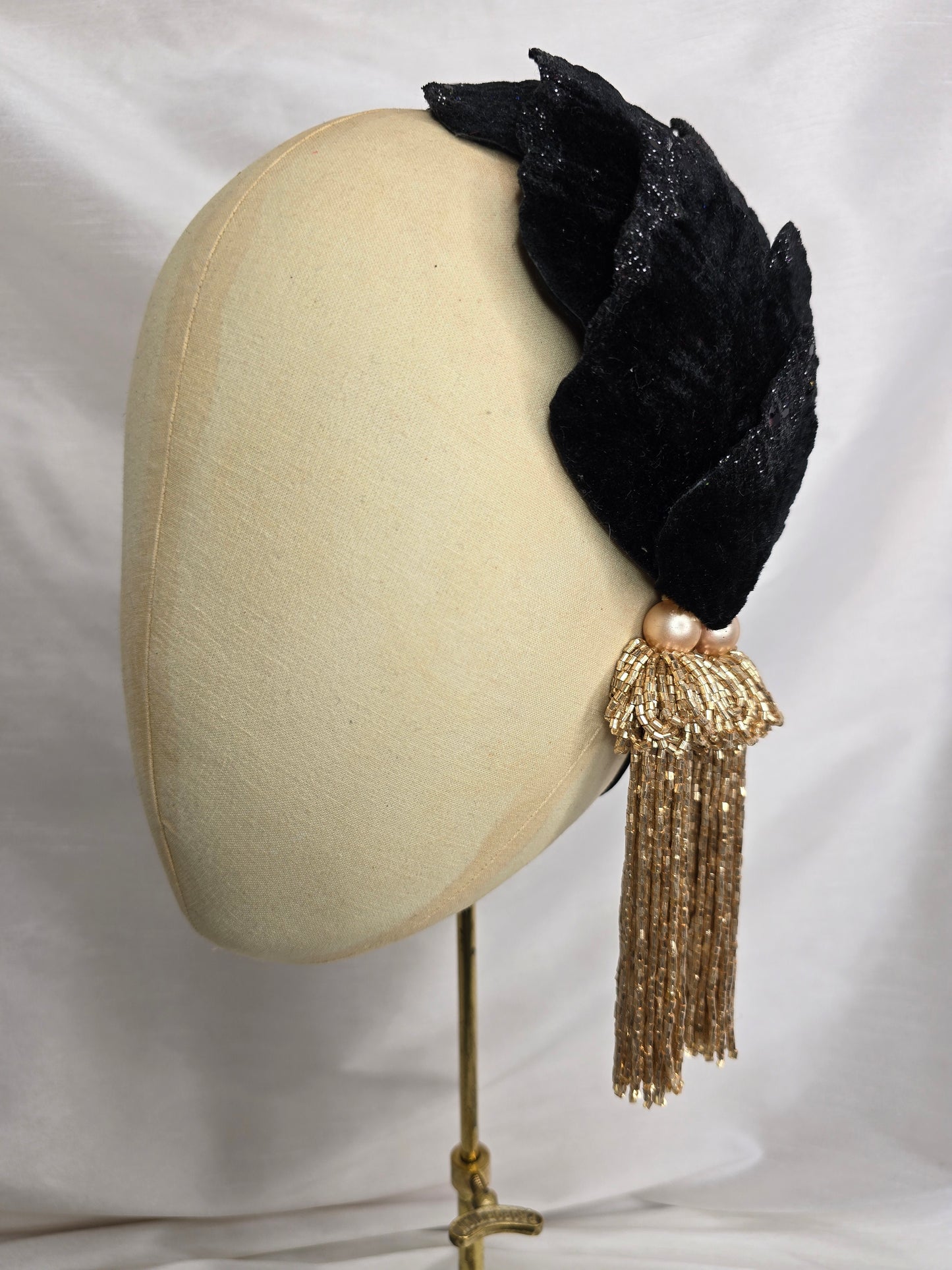 Black velvet glittered half hat/fascinator with gold beaded tassels