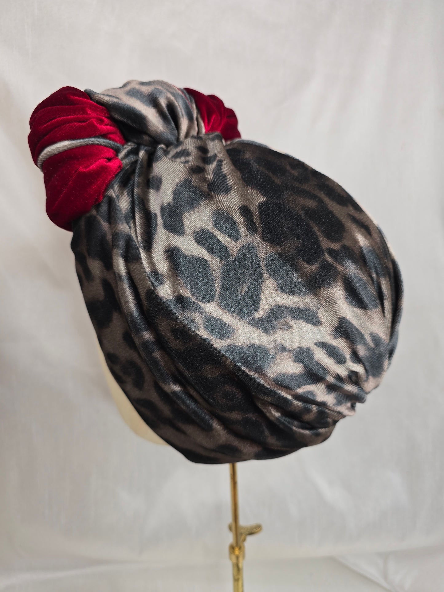 Red and leopard stretch velvet turban with corsage