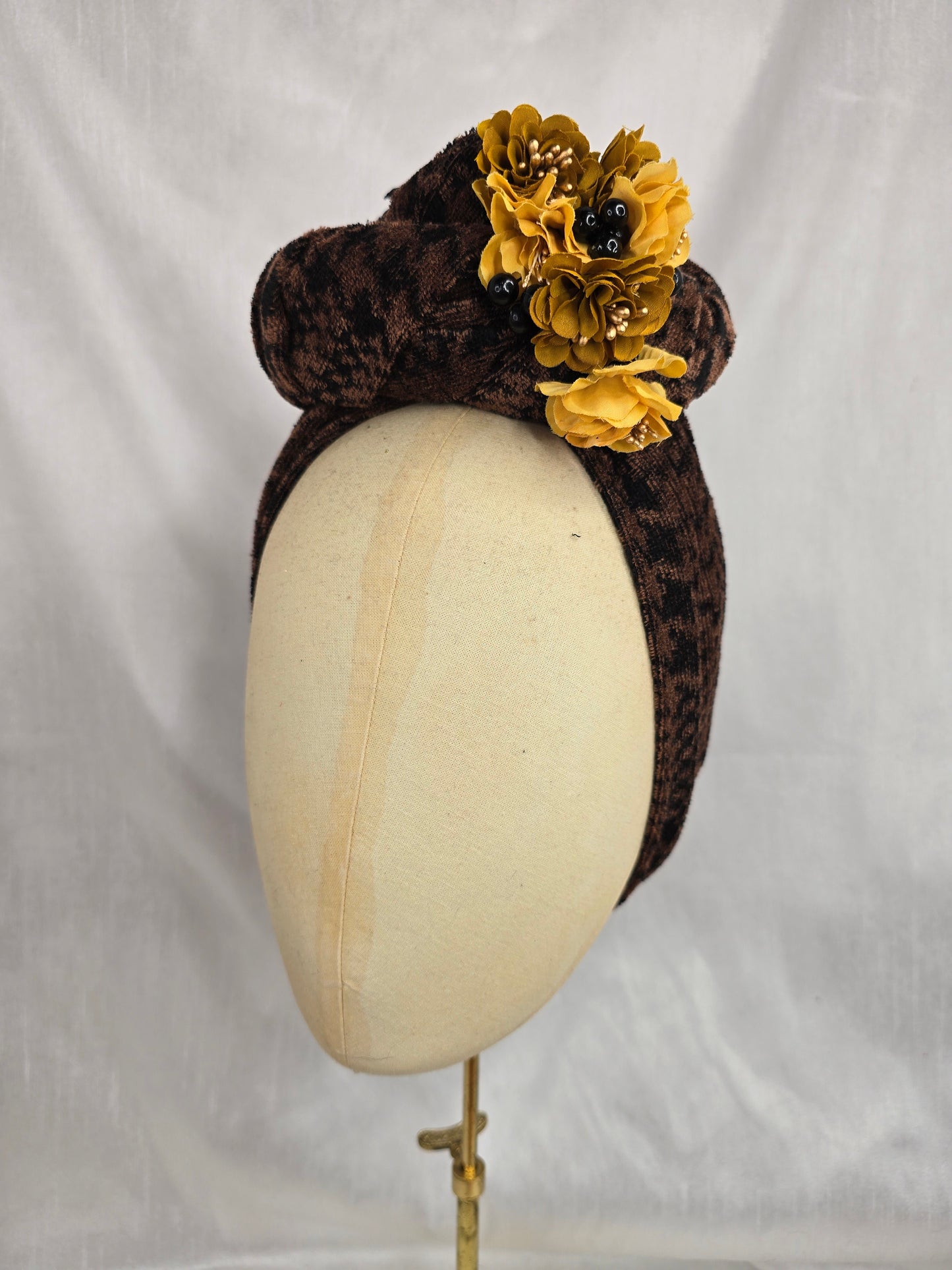 Brown houndstooth stretch velvet turban with mustard flowers