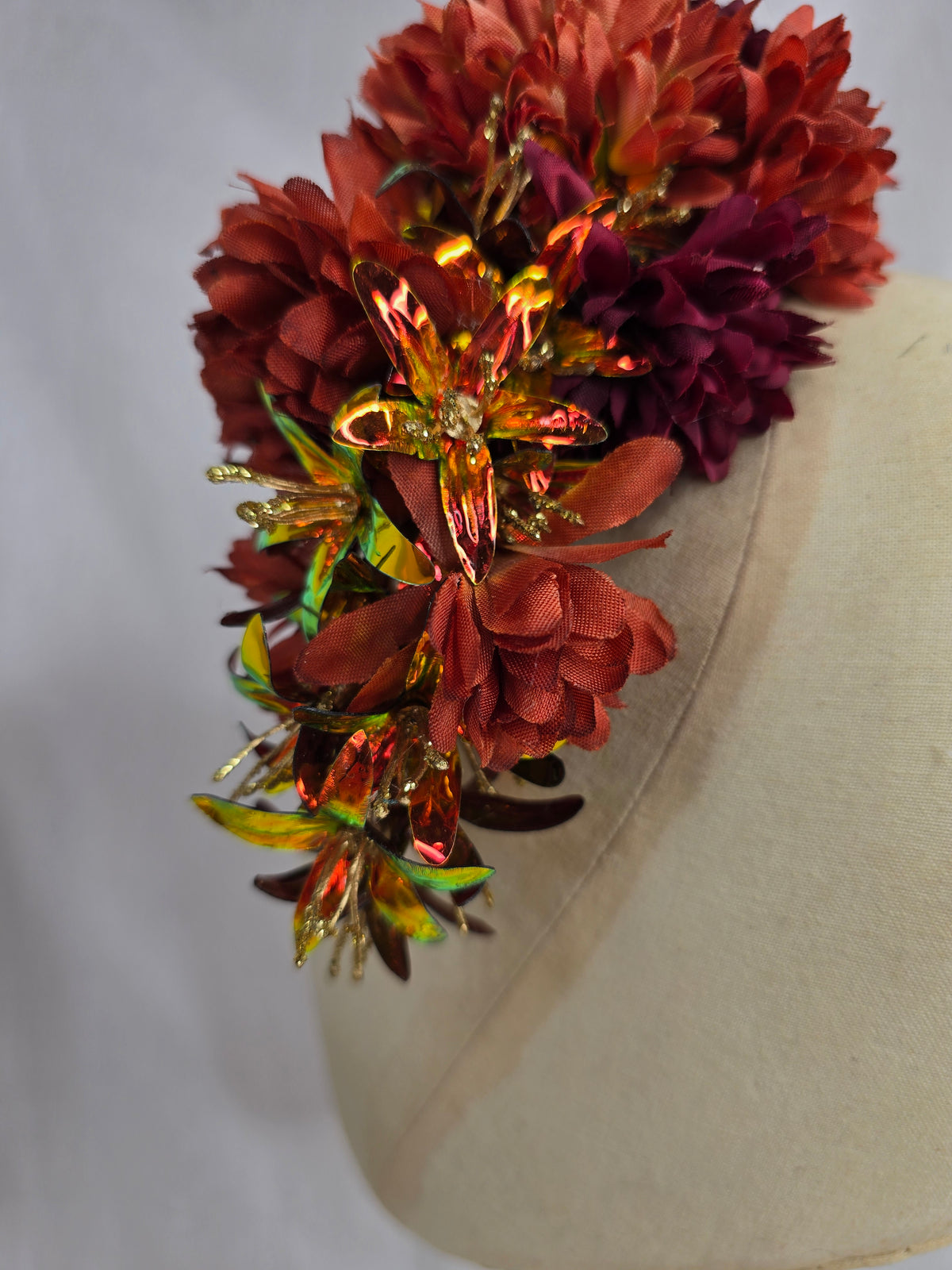 Medium orange, maroon and iridescent orange hair flower