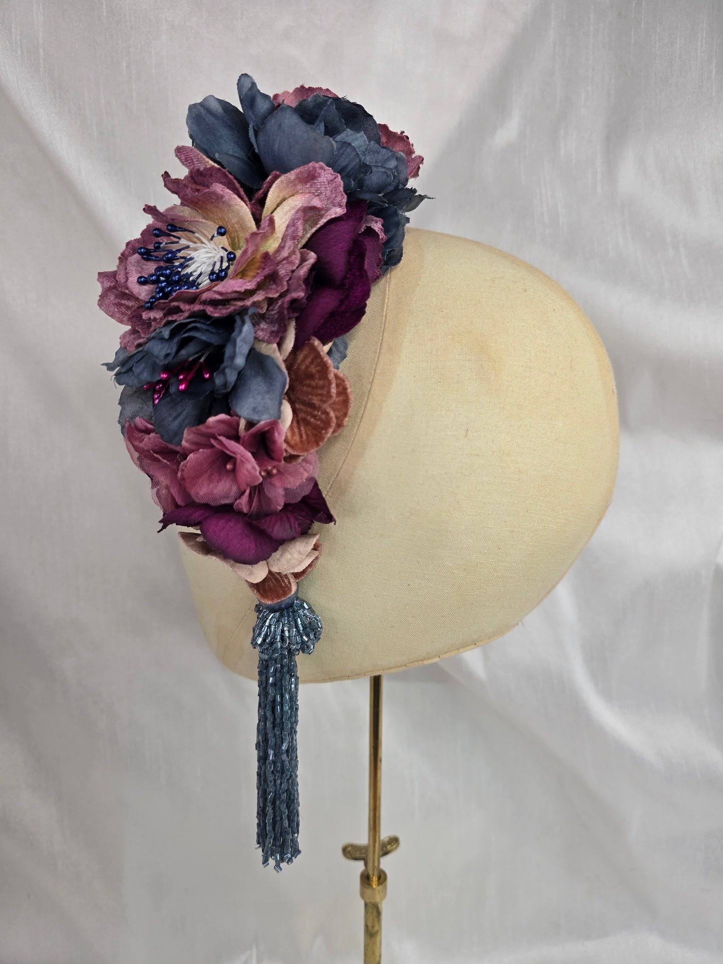 Large purple and blue flower headpiece with beaded tassel
