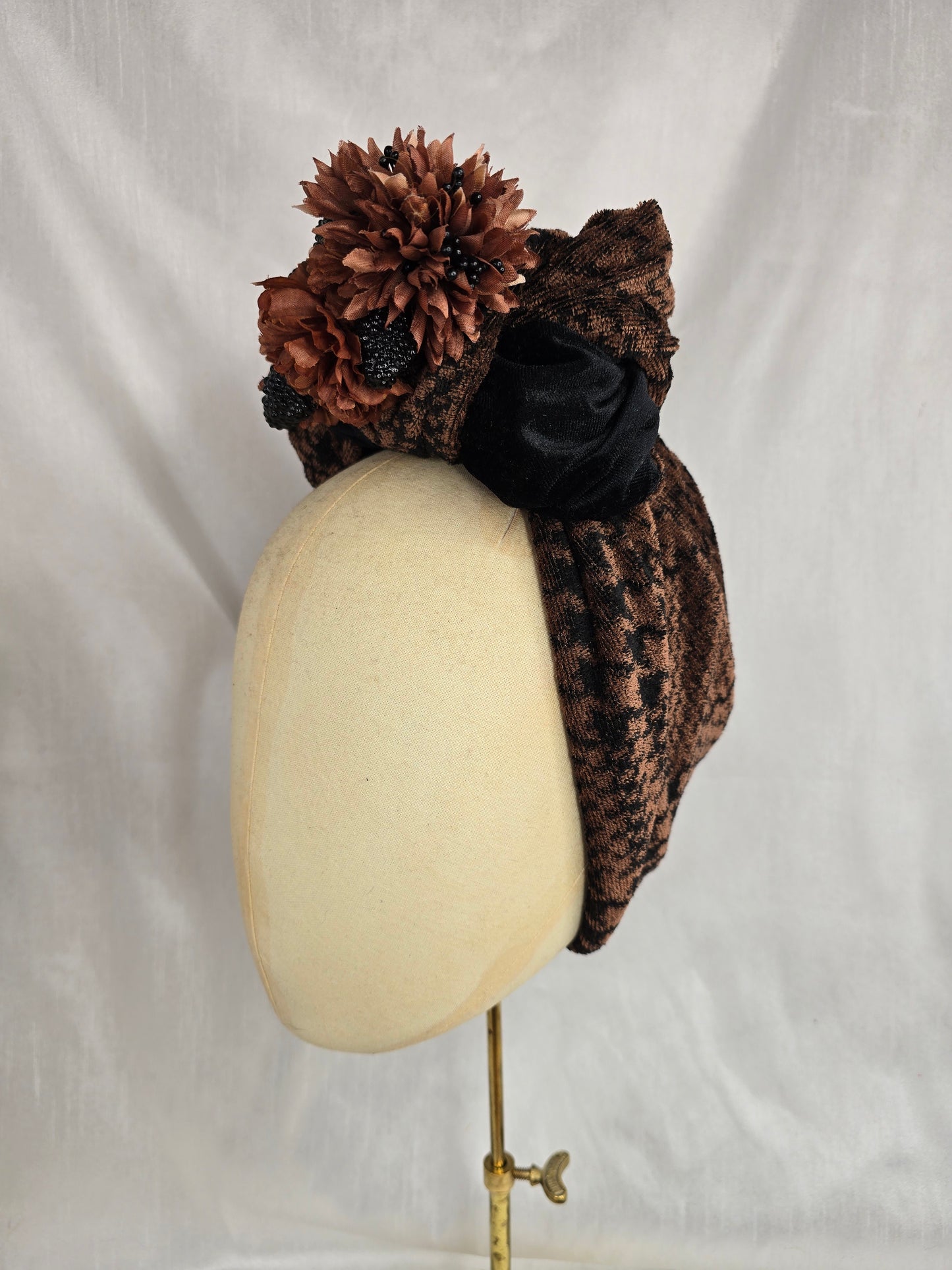 Brown houndstooth and black stretch velvet turban with brown flowers