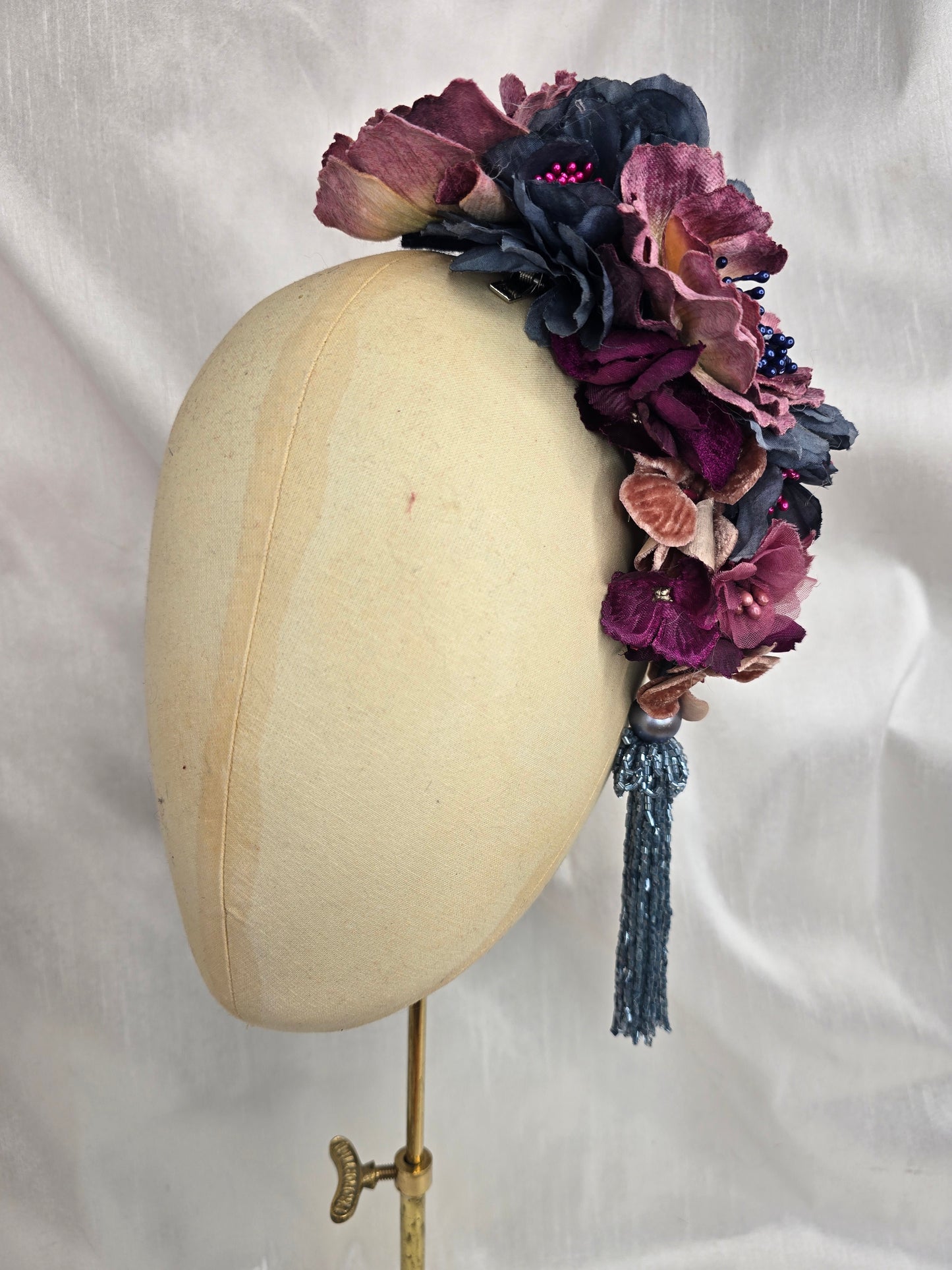 Large purple and blue flower headpiece with beaded tassel