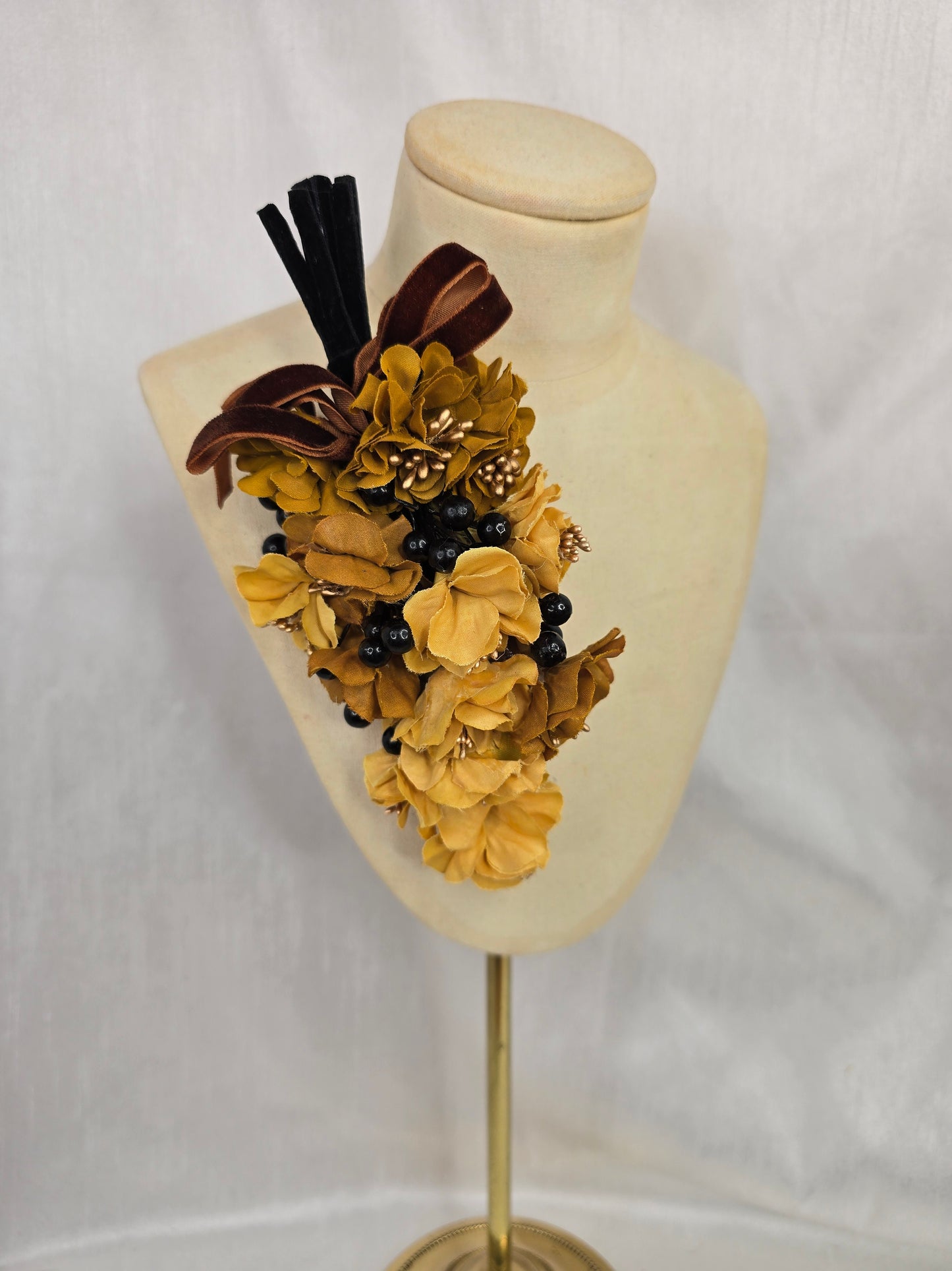Brown houndstooth stretch velvet turban with mustard flowers
