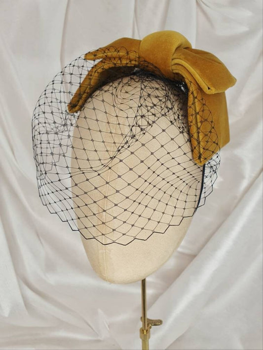 Veiled gold velvet hair bow