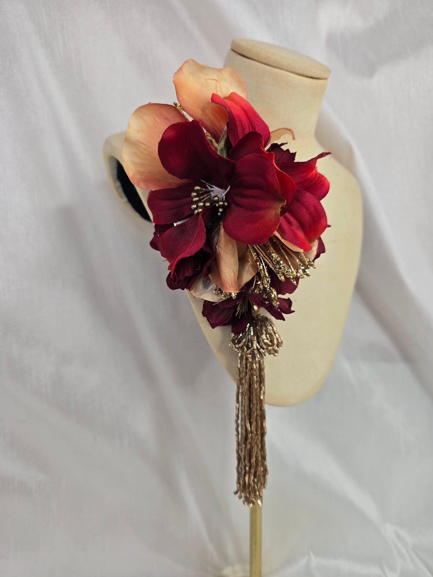 Medium pale orange, red and gold flower headpiece with gold beaded tassel