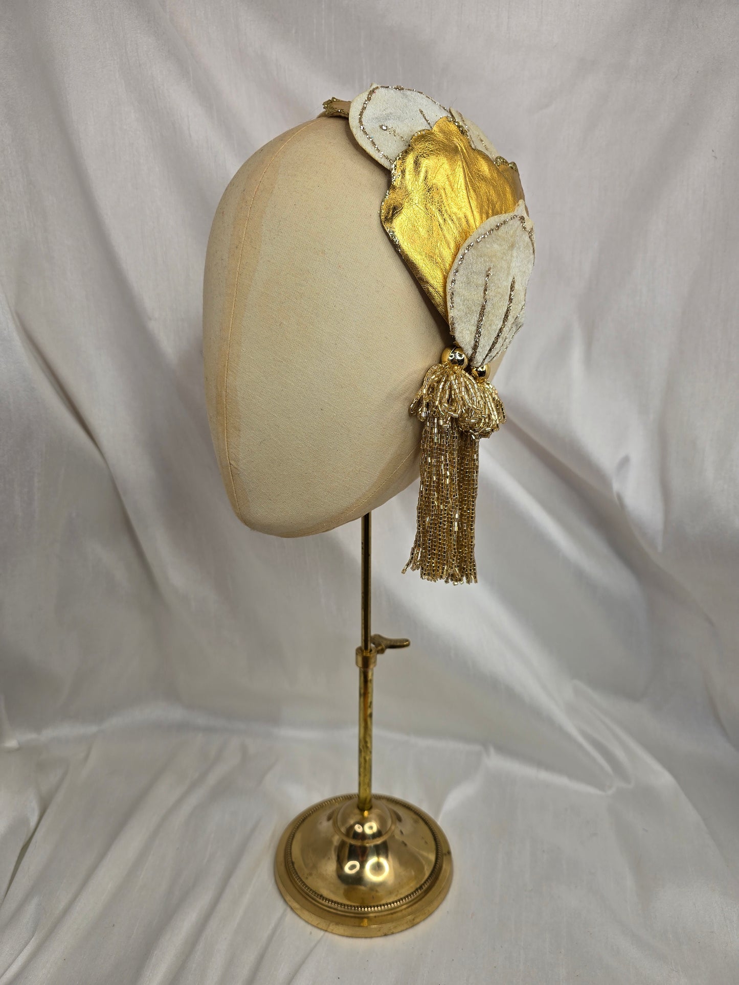 Ivory and gold half hat/fascinator with beaded tassels