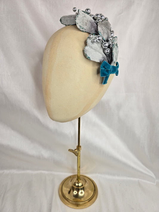 Silver velvet and aqua petal fascinator with bow and berries