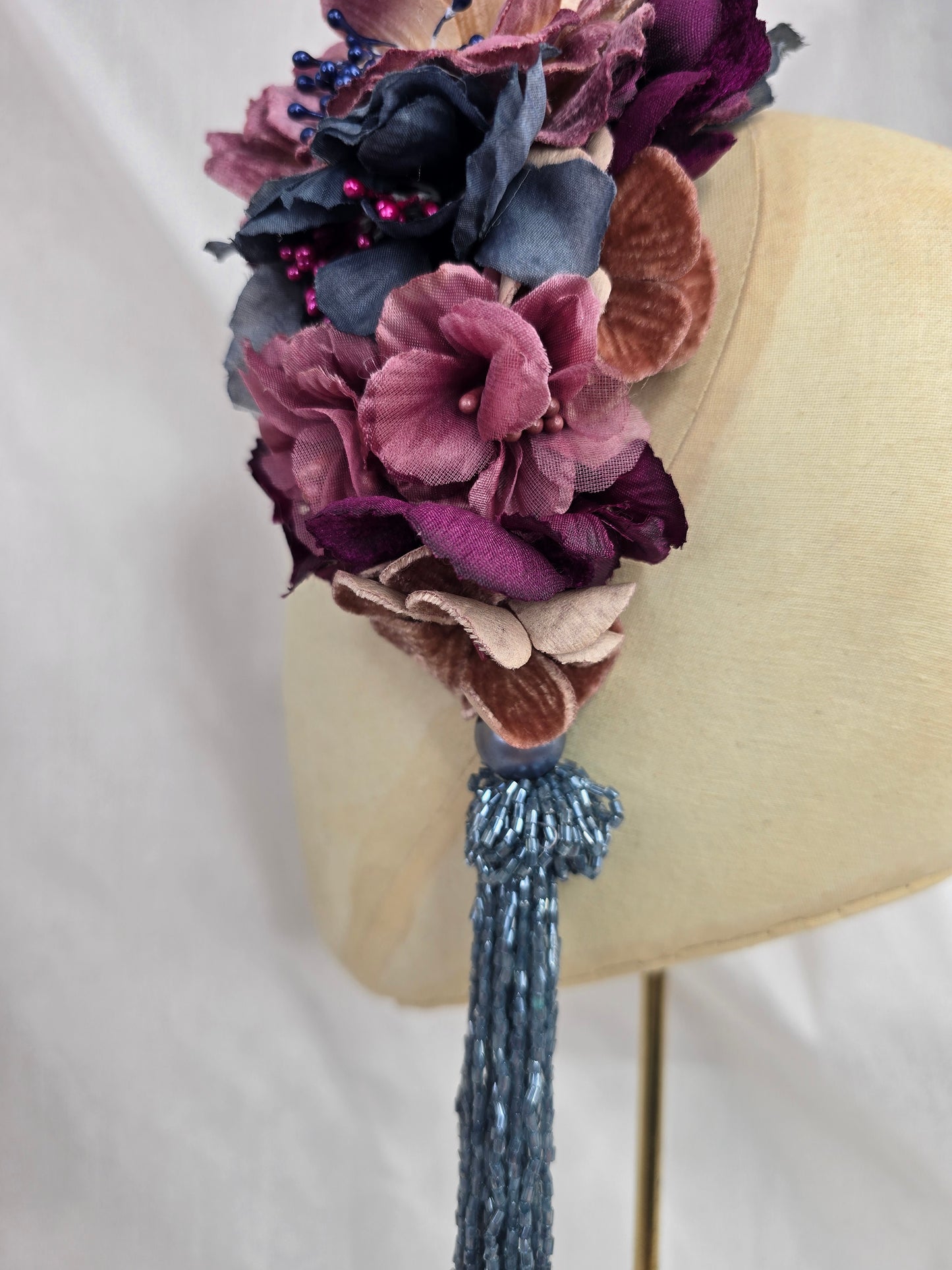 Large purple and blue flower headpiece with beaded tassel