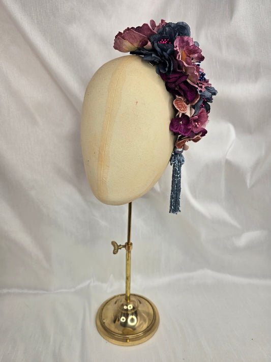 Large purple and blue flower headpiece with beaded tassel