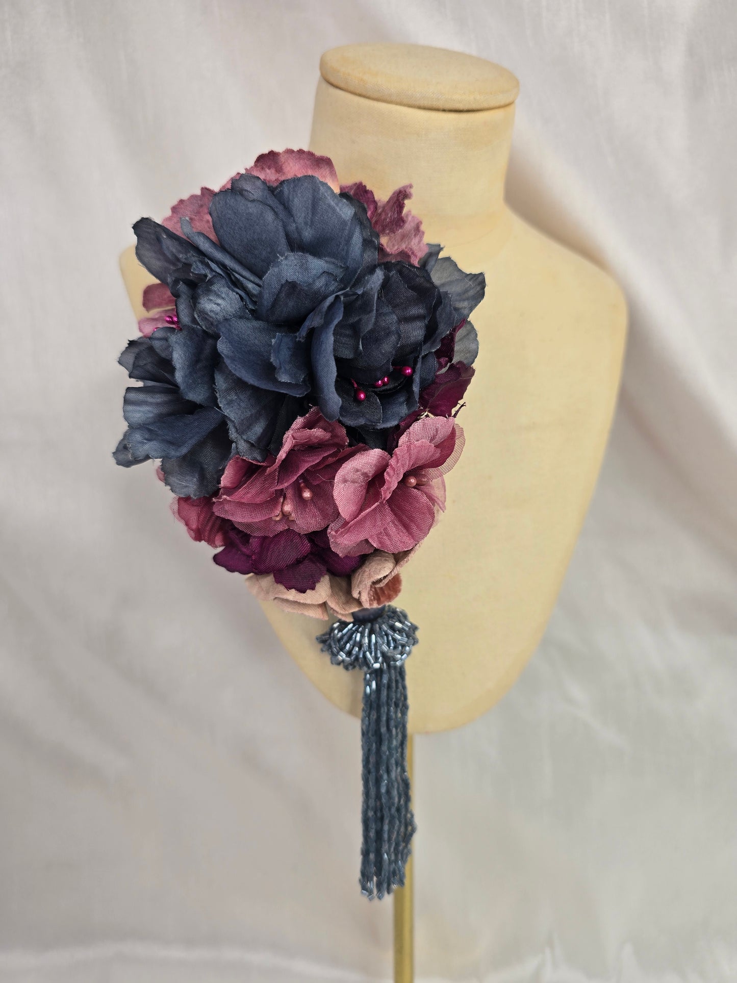 Medium purple and blue flower headpiece with beaded tassel
