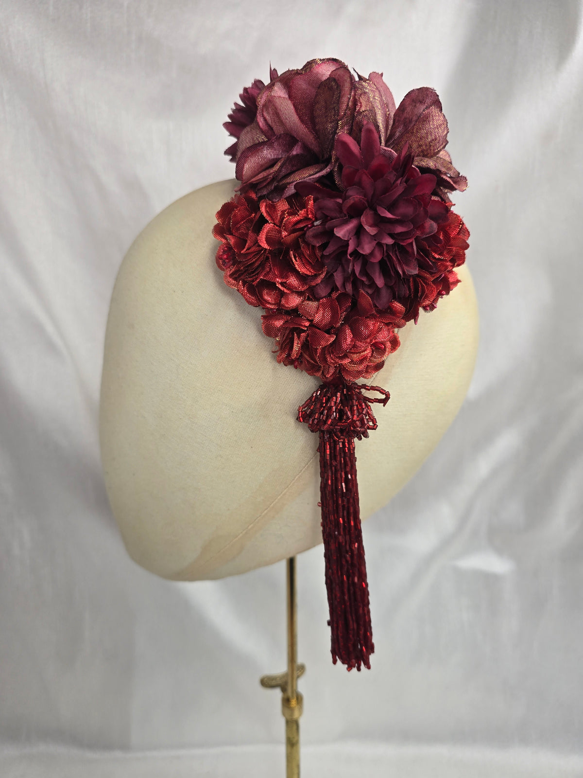 Medium autumn red flower headpiece/corsage with beaded tassel