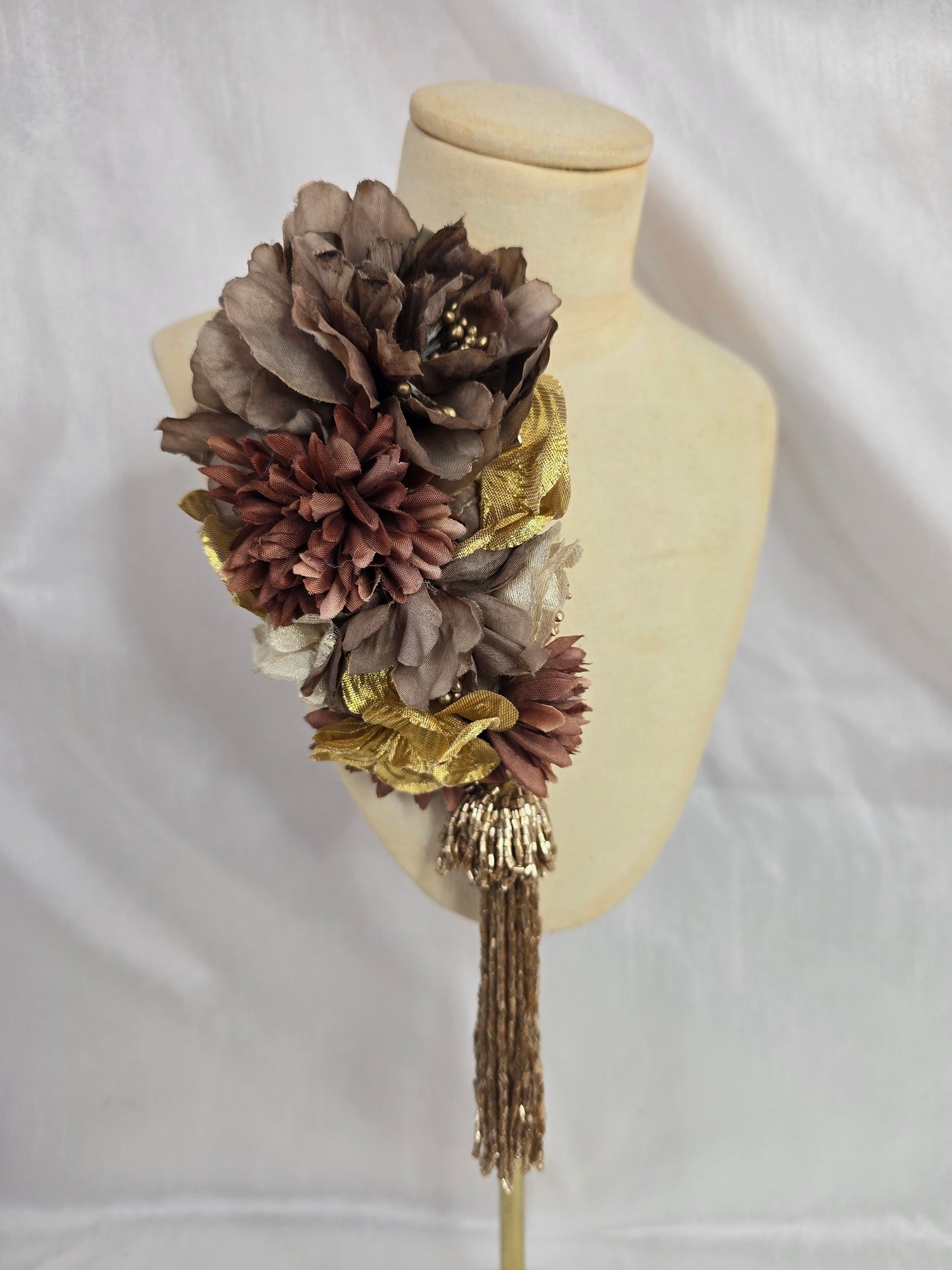 Brown and gold medium headpiece with gold beaded tassel