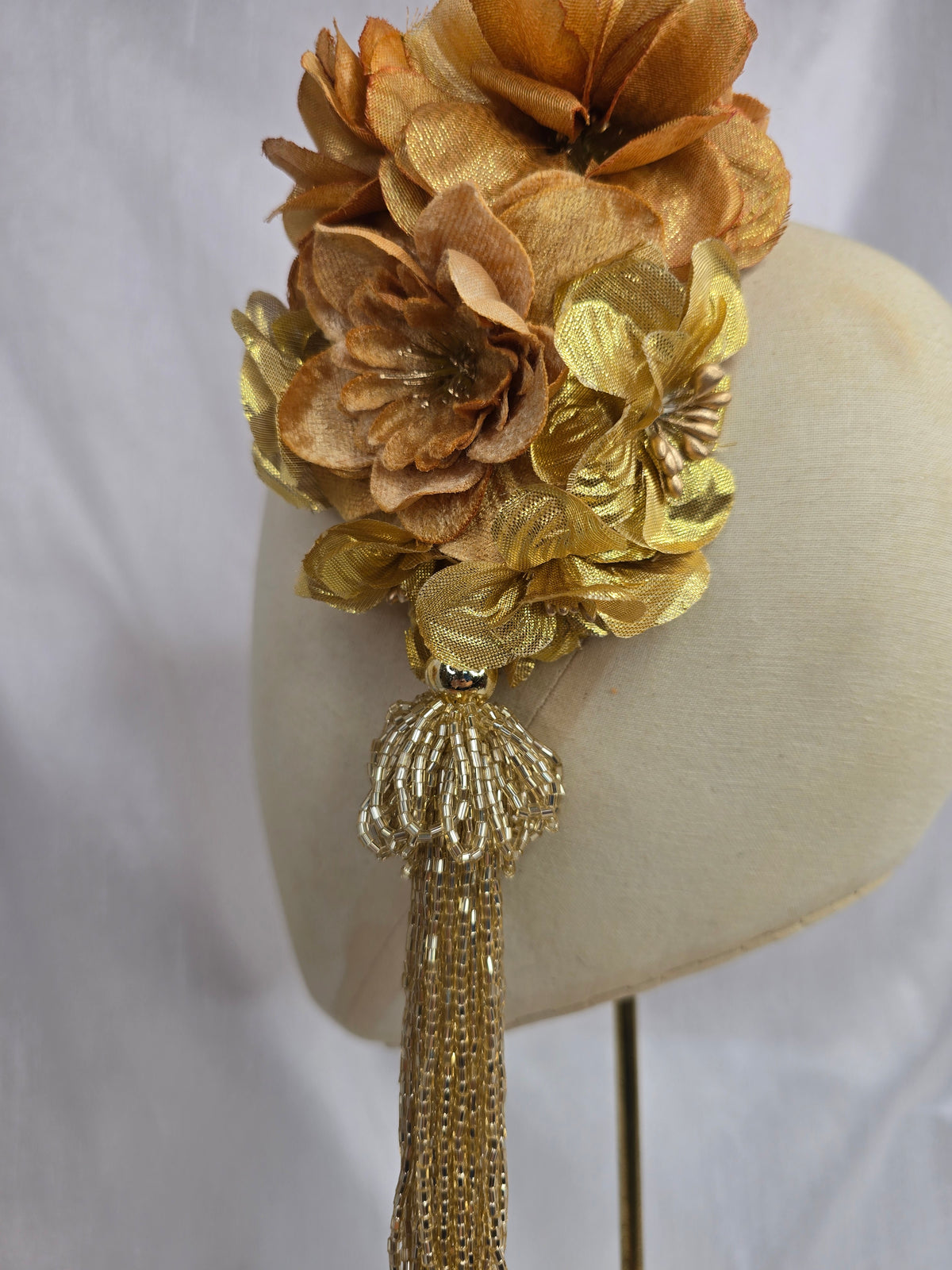 Medium autumn gold flower headpiece/corsage with beaded tassel