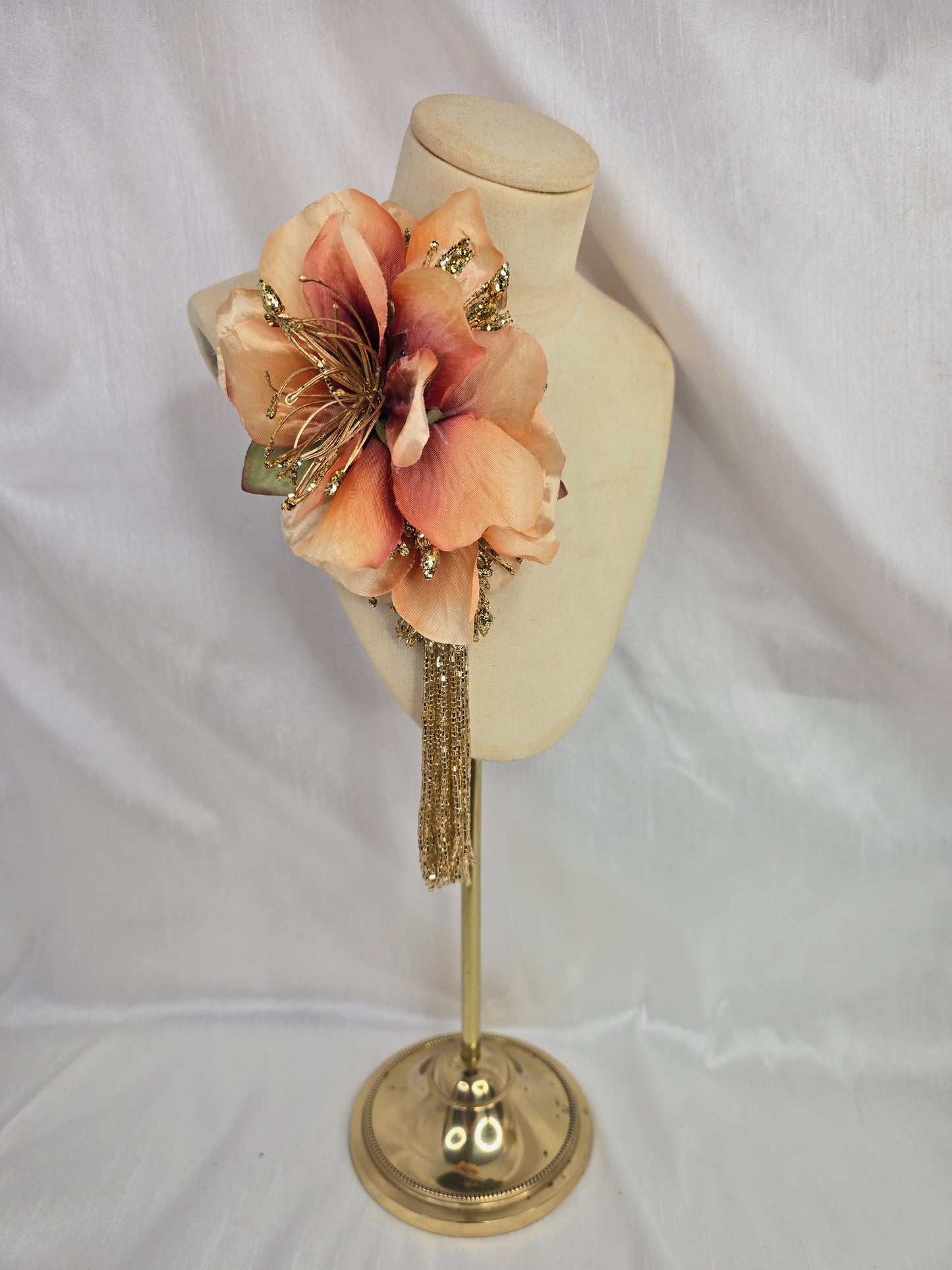 Medium pale orange and gold hair flower/corsage with beaded tassel