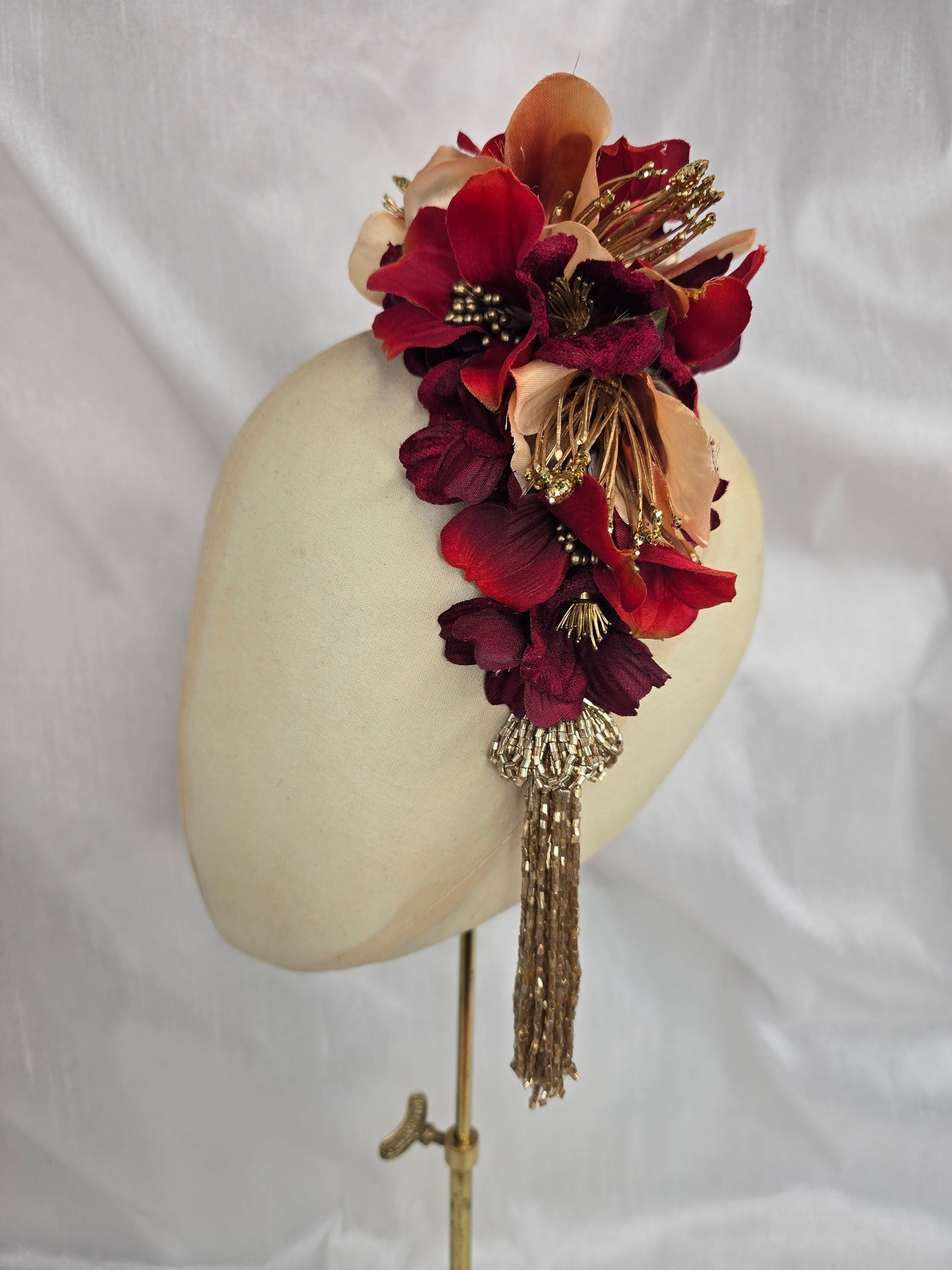 Large pale orange, red and gold flower headpiece with gold beaded tassel