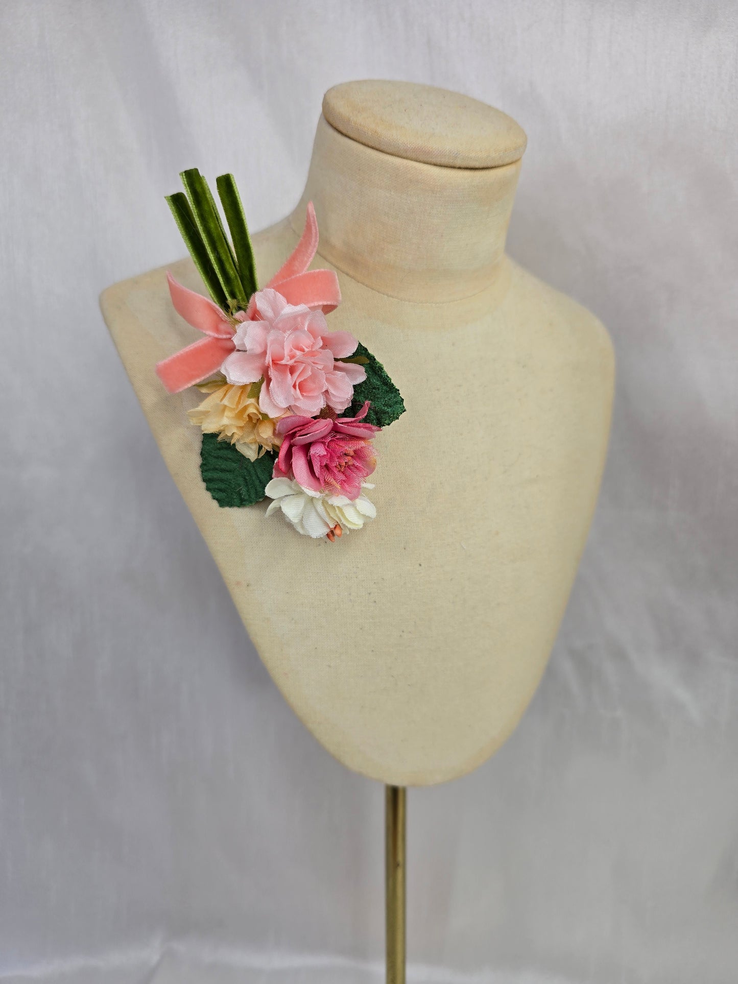 Small apricot, pink and white blossom corsage