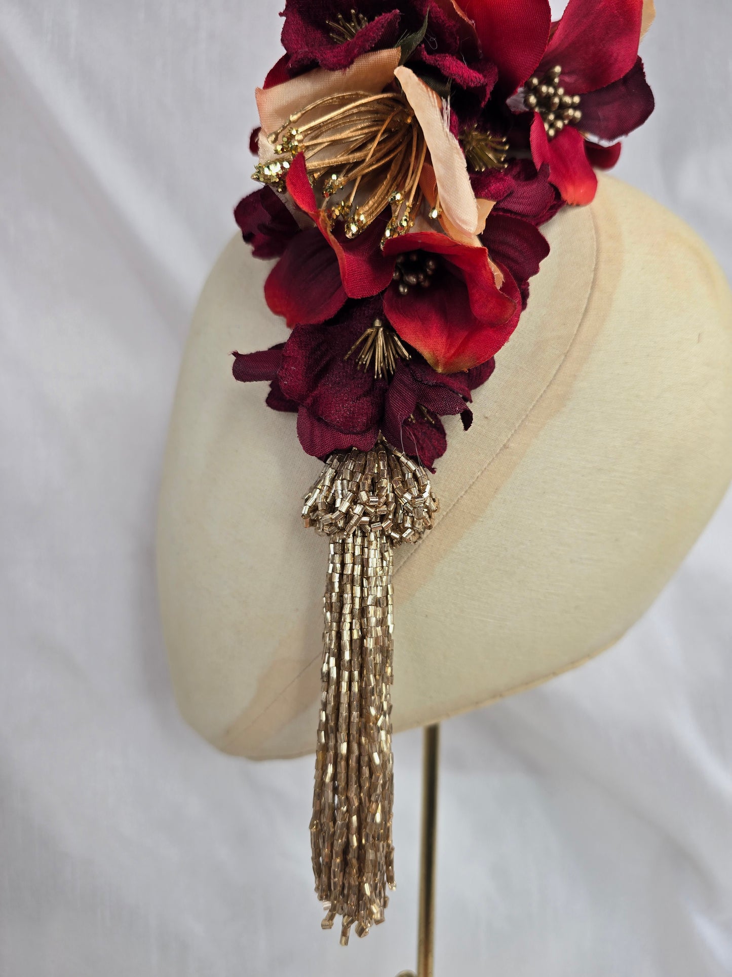 Large pale orange, red and gold flower headpiece with gold beaded tassel