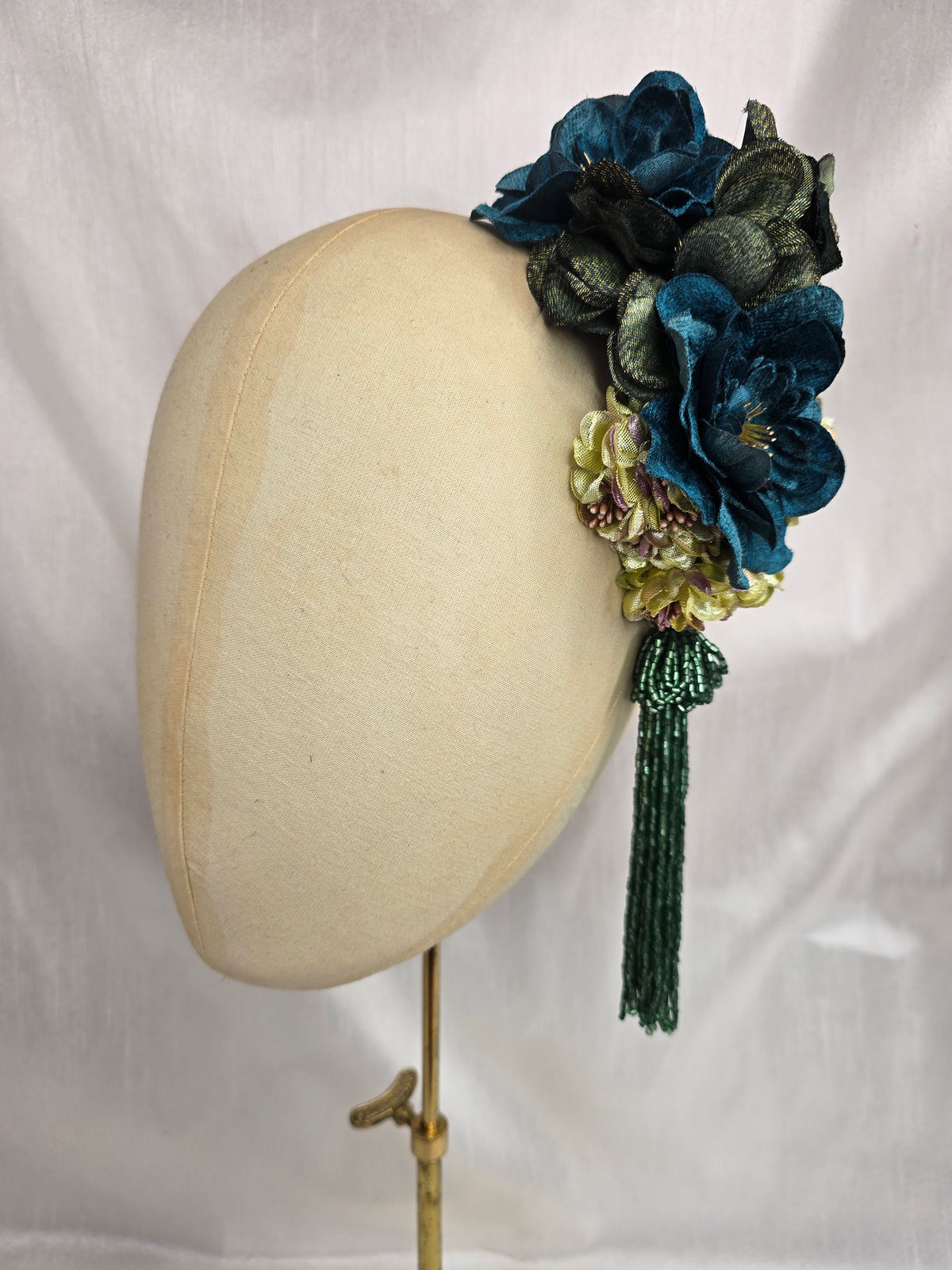 Medium teal, green, gold and chartreuse flower headpiece/corsage with beaded tassel