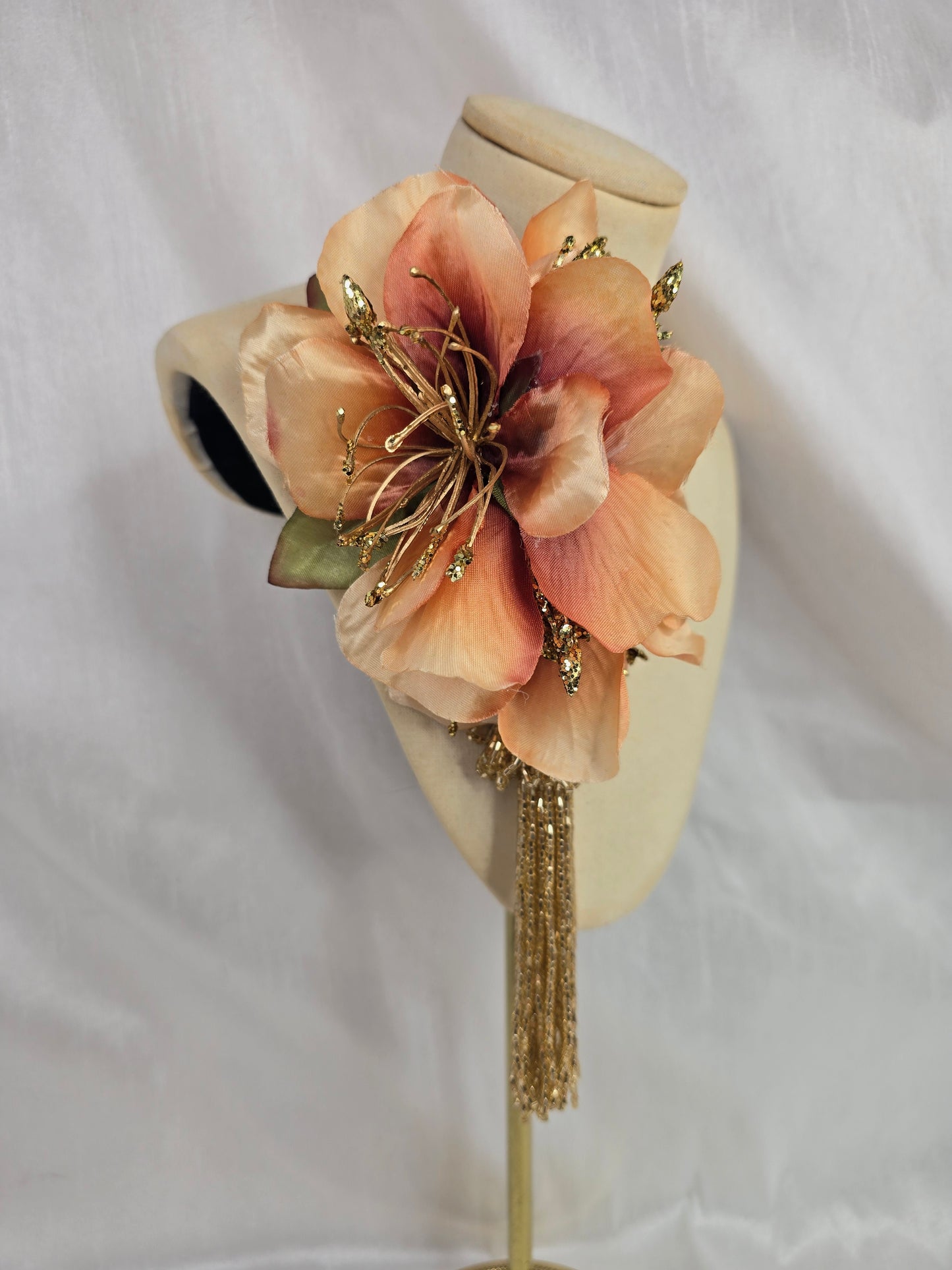 Medium pale orange and gold hair flower/corsage with beaded tassel