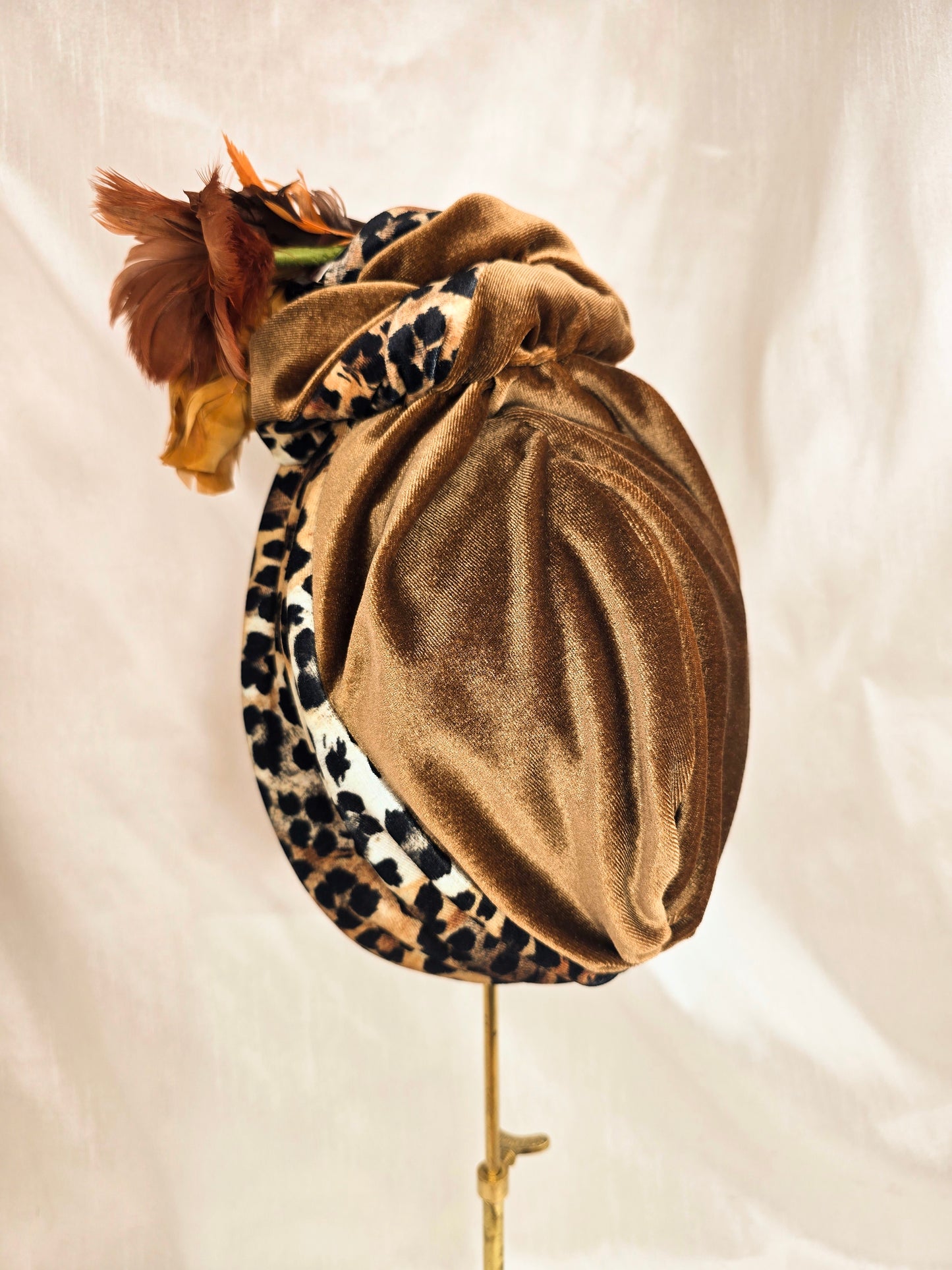 Tan and leopard stretch velvet turban with vintage feather trim and corsage