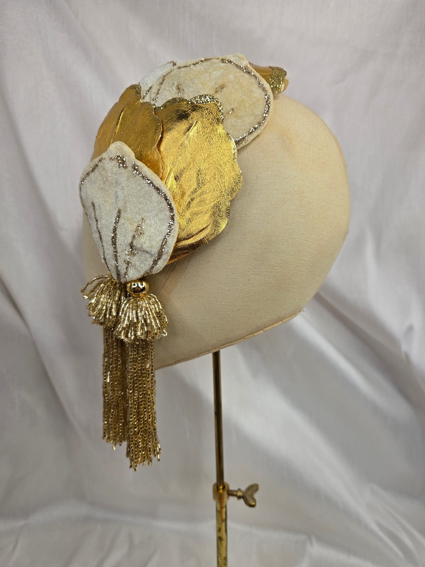 Ivory and gold half hat/fascinator with beaded tassels