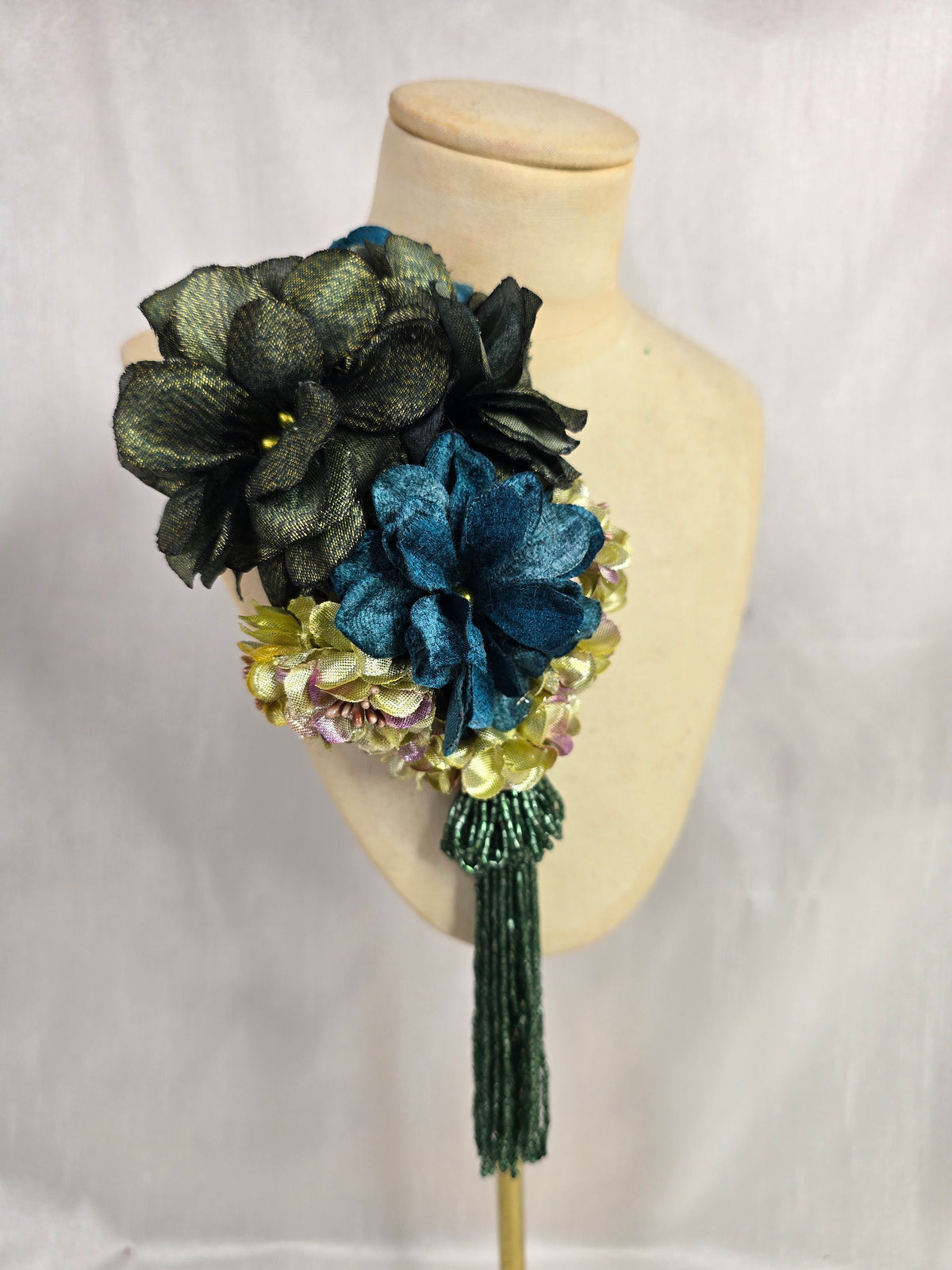 Medium teal, green, gold and chartreuse flower headpiece/corsage with beaded tassel