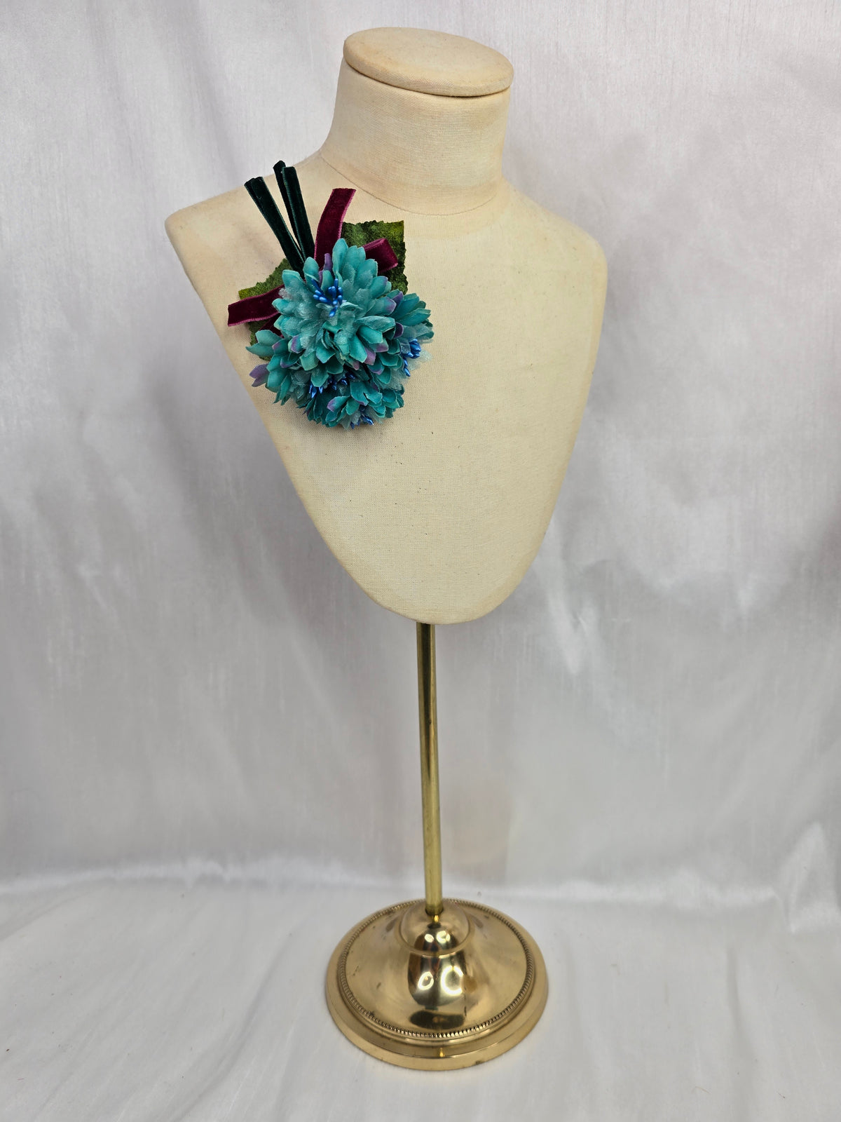 Small teal blossom corsage