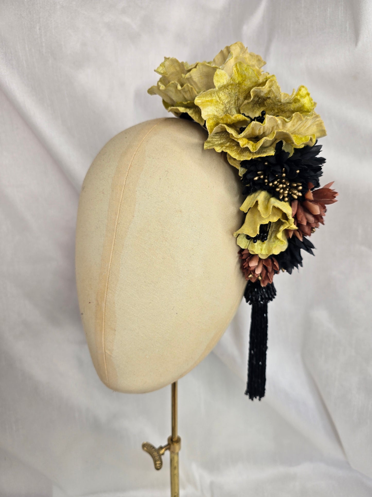 Large chartruese yellow, black and gold flower headpiece with black beaded tassel