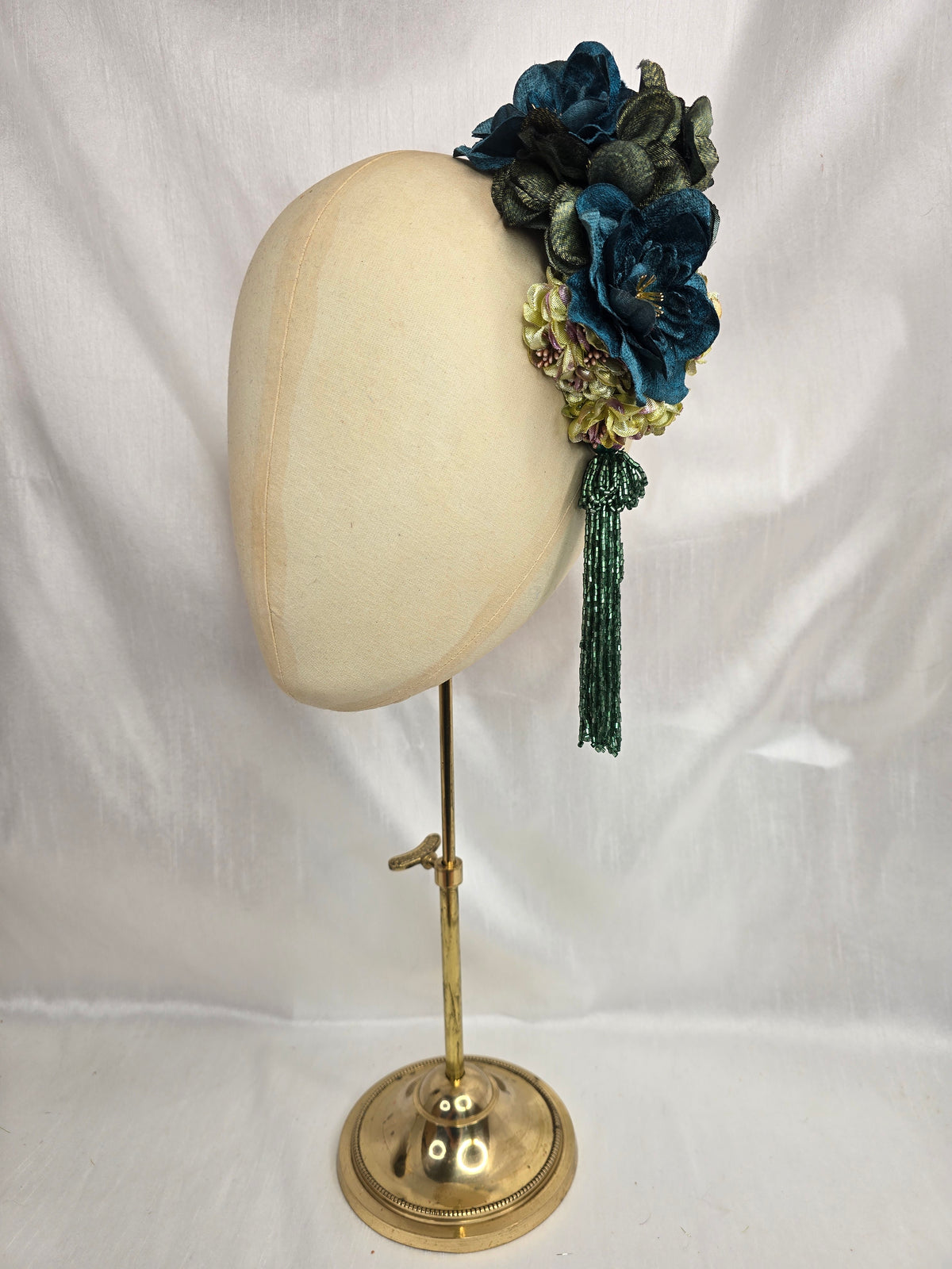 Medium teal, green, gold and chartreuse flower headpiece/corsage with beaded tassel