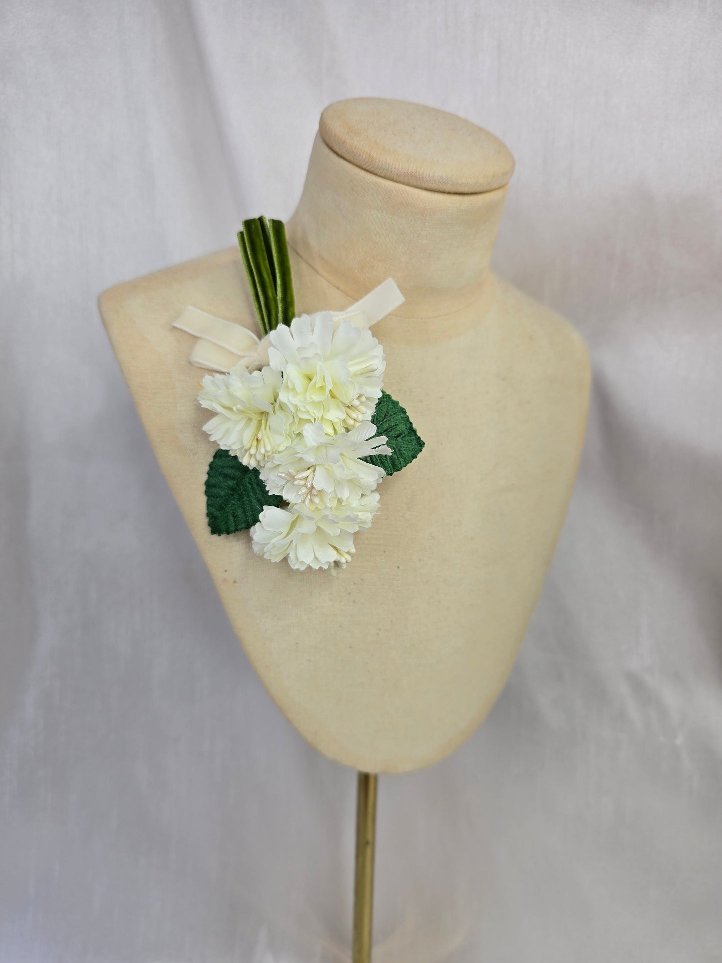 Small white blossom corsage