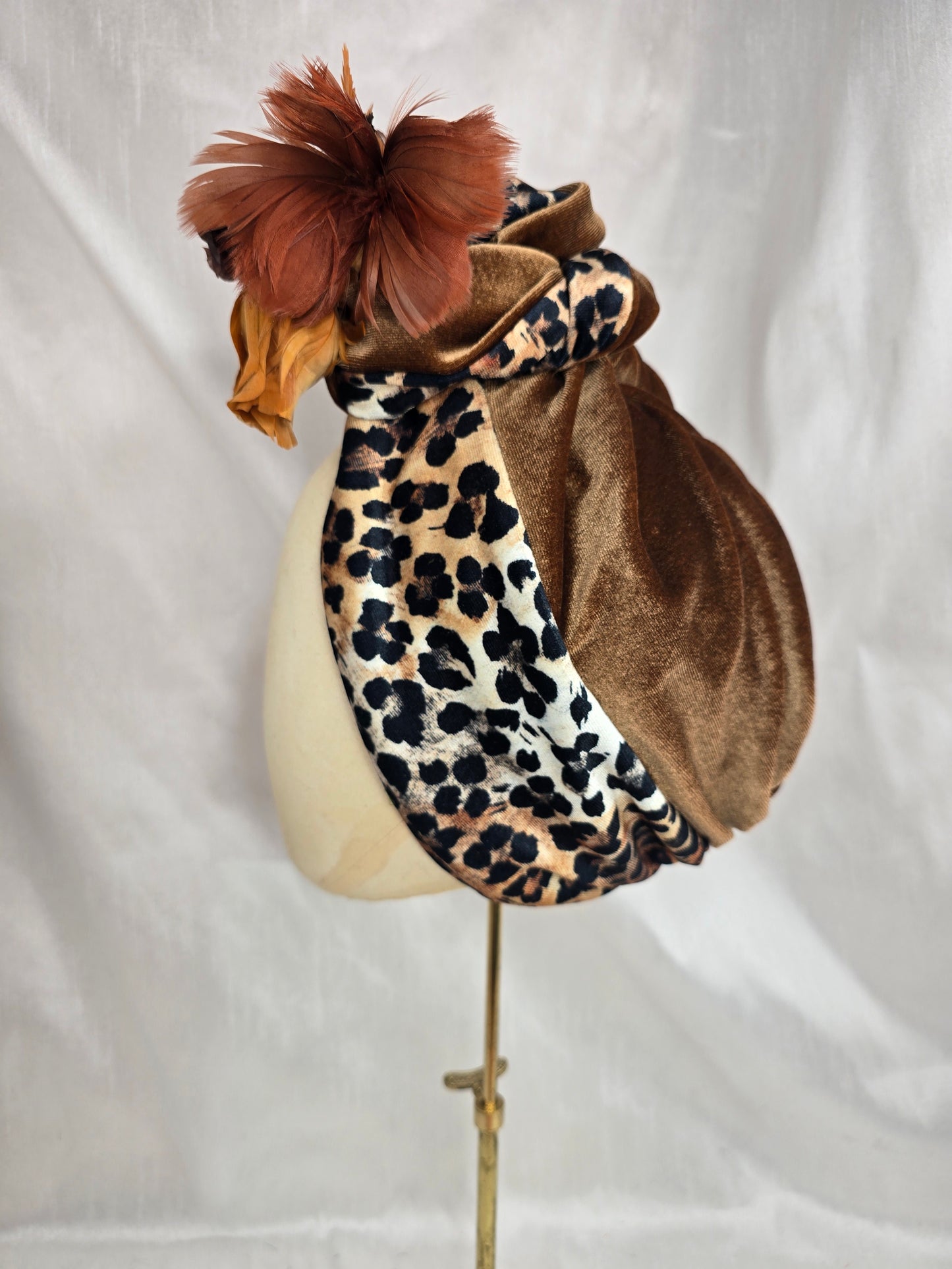 Tan and leopard stretch velvet turban with vintage feather trim and corsage