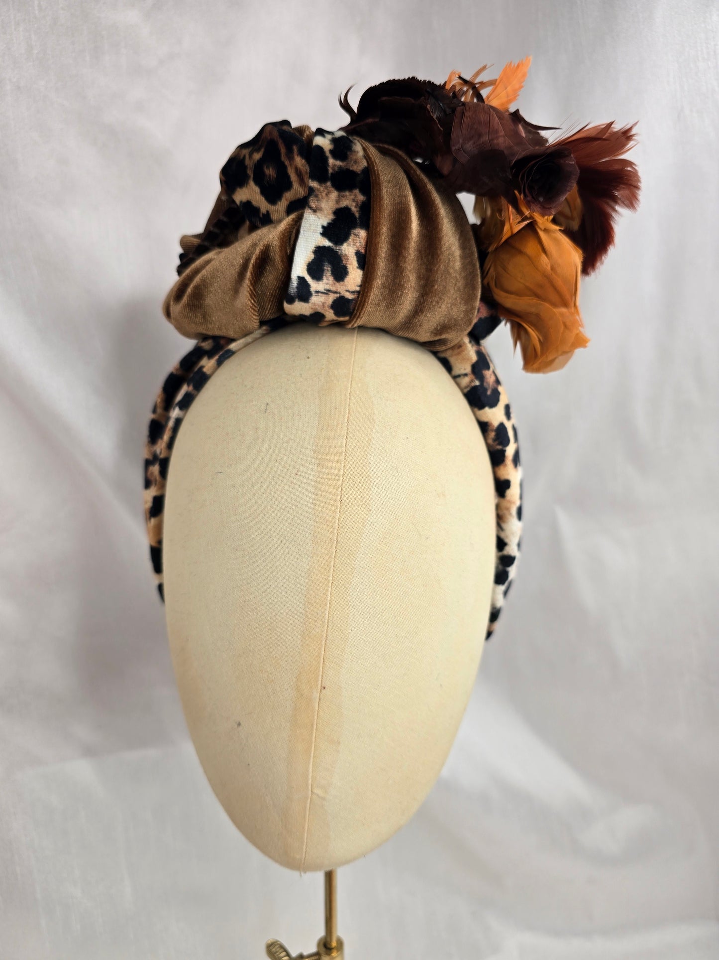 Tan and leopard stretch velvet turban with vintage feather trim and corsage