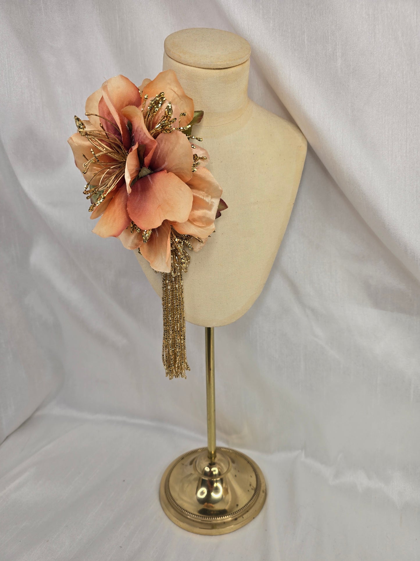 Medium pale orange and gold hair flower/corsage with beaded tassel