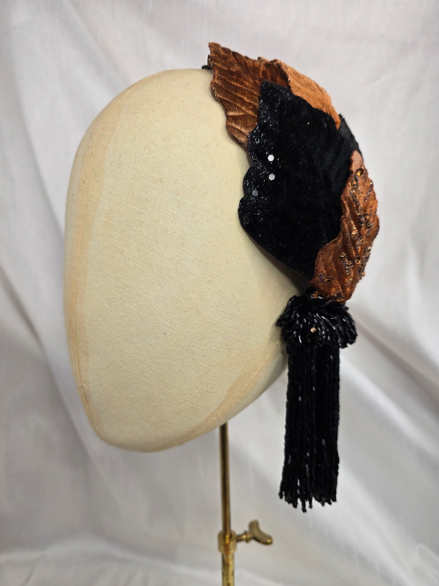 Black and copper half hat/fascinator with beaded tassels